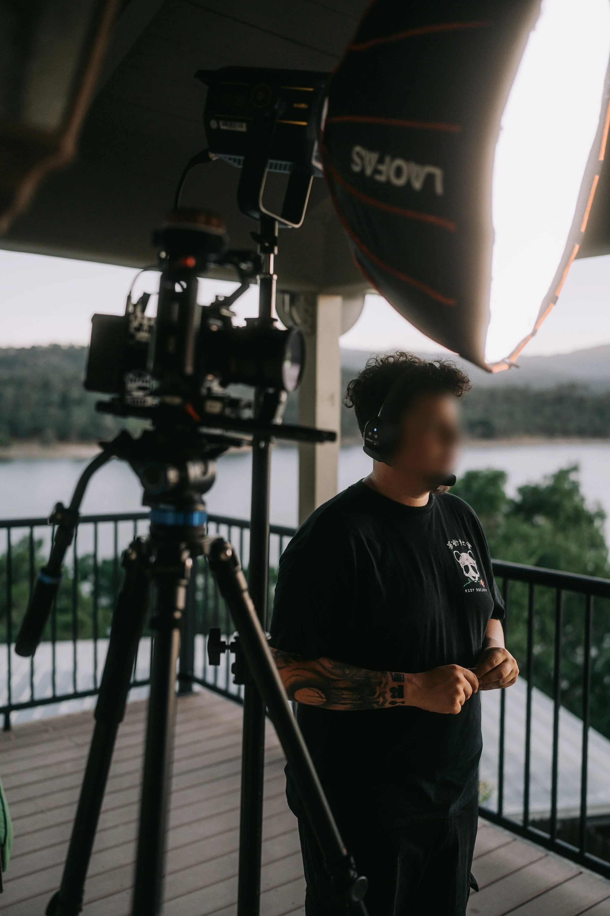 Close-up of a professional cinema camera rig and studio lighting equipment used for high-end video production on the Central Coast.