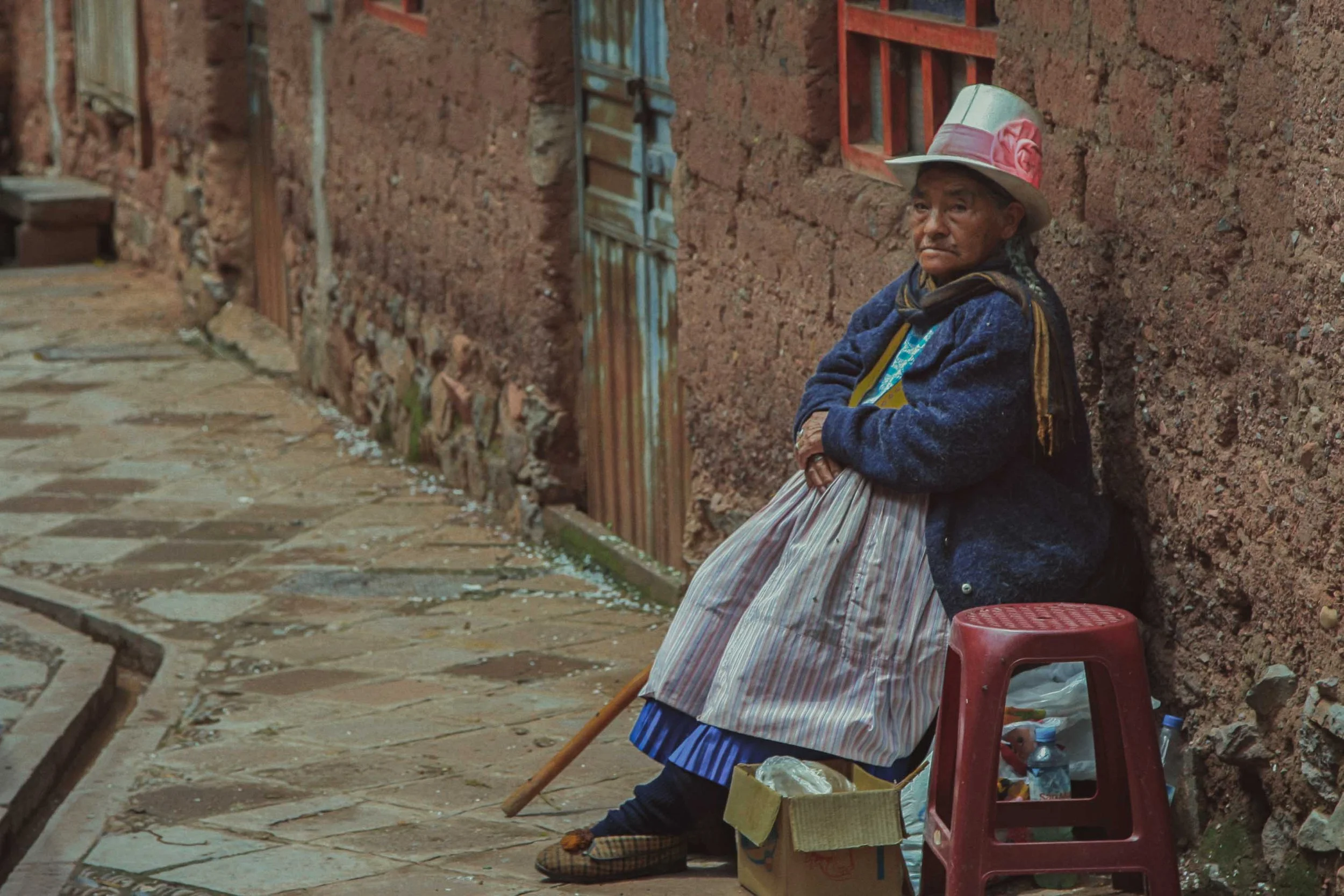 Elderly Woman Resting at the Entrance of Her Home, Cuzco - Peru