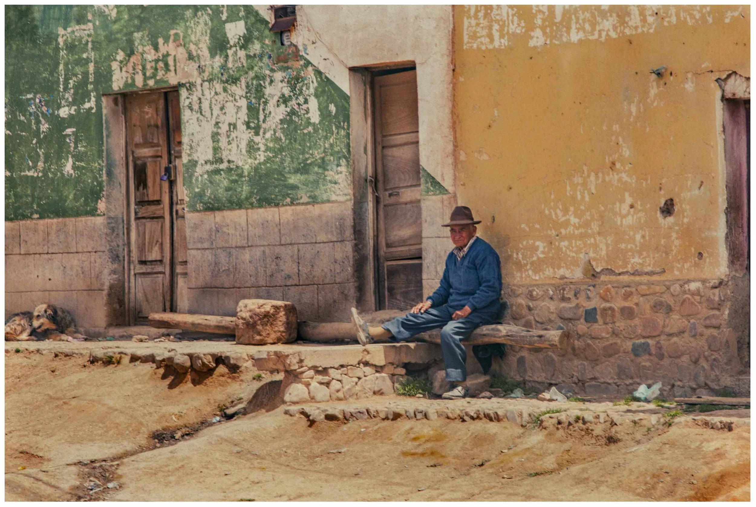 Bolivian Man Resting at the Entrance of His Home