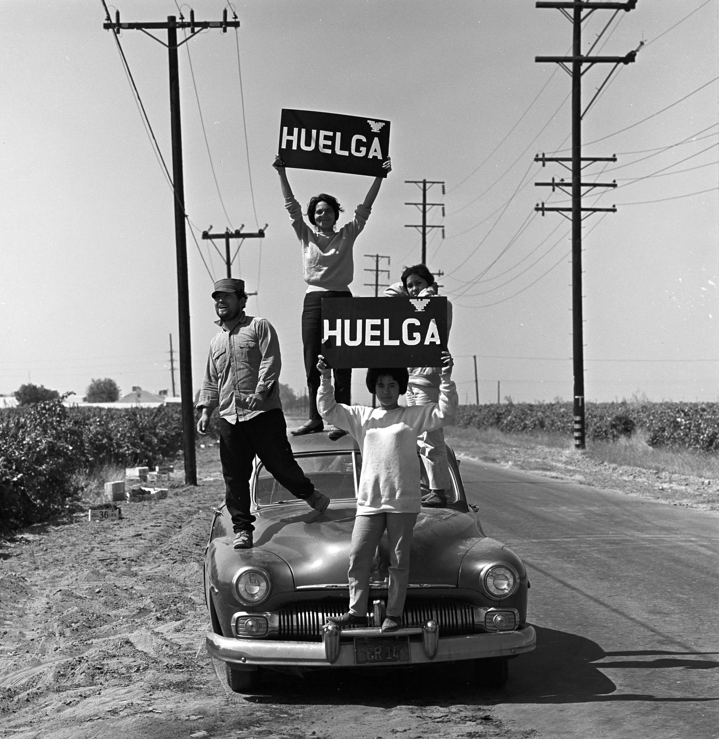 Dolores Huerta, atop a car, calling on farmworkers to leave the fields and join the strike in 1965—Photo by Harvey Wilson Richards, Courtesy of Paul Richards