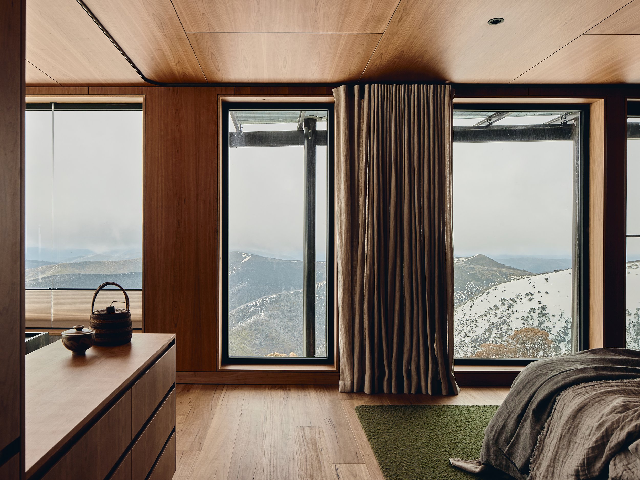 17. Primary bedroom with views across Mount Hotham.jpg