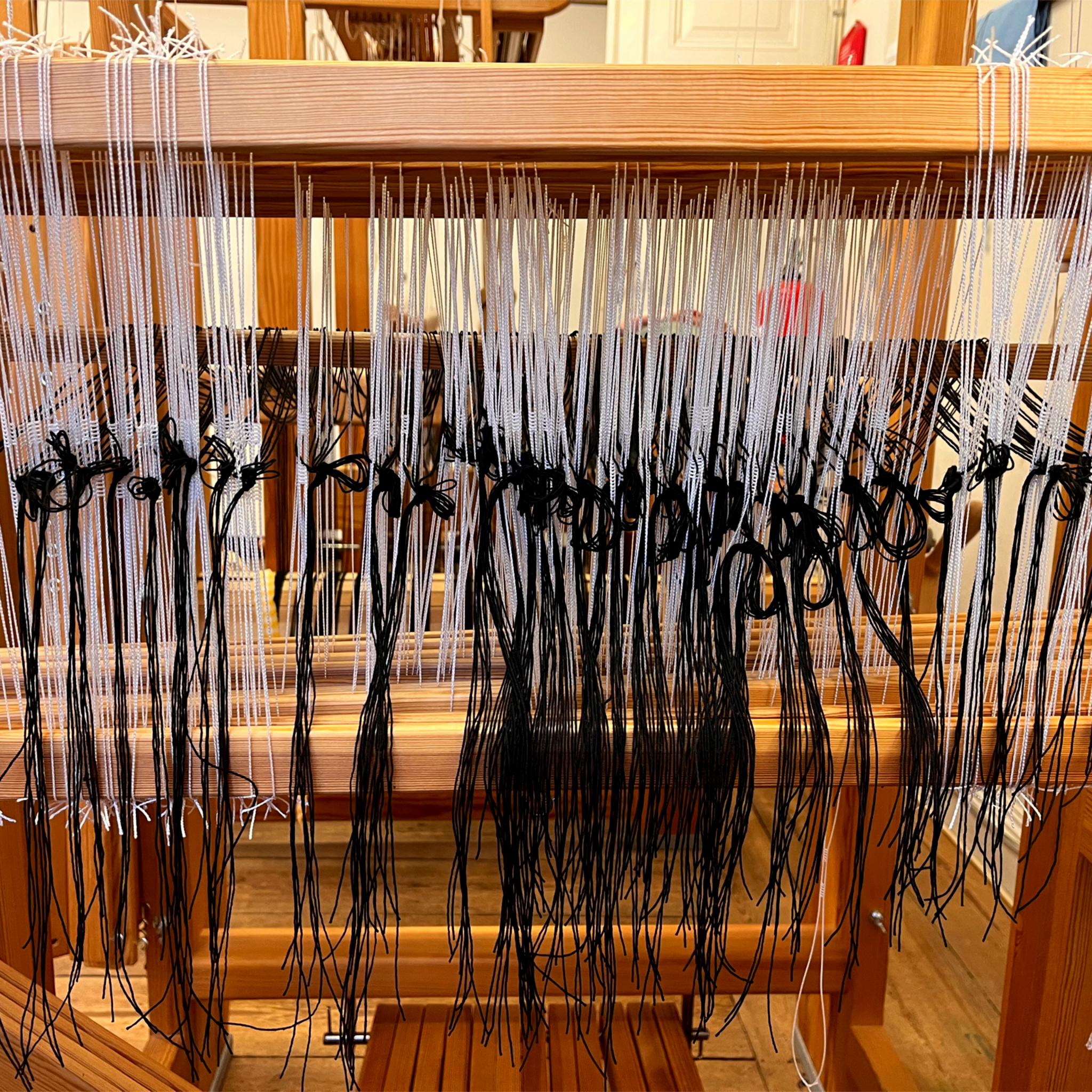 Setting up the loom for hand weaving, process picture