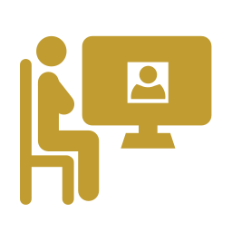 Silhouette of a person sitting at a desk with a computer, participating in a video call or online meeting.