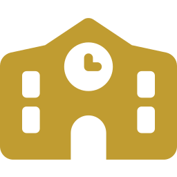 A gold-colored school building with a clock tower in the center.