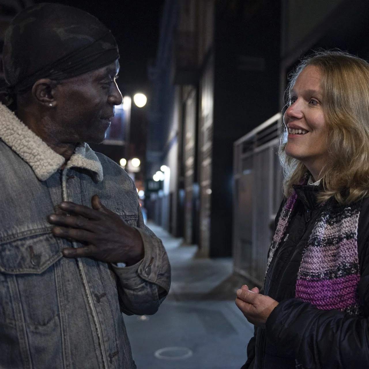 CPE Educator Rev. Cathy Schreiber talks with a neighbor on a night walk