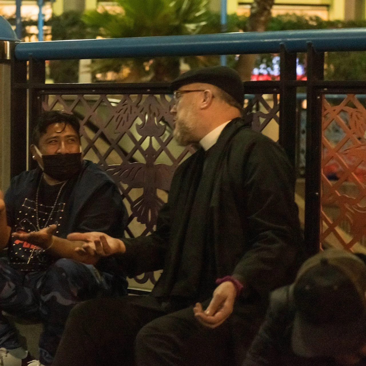 Faithful & Fabulous minister John Brett speaks with a neighbor