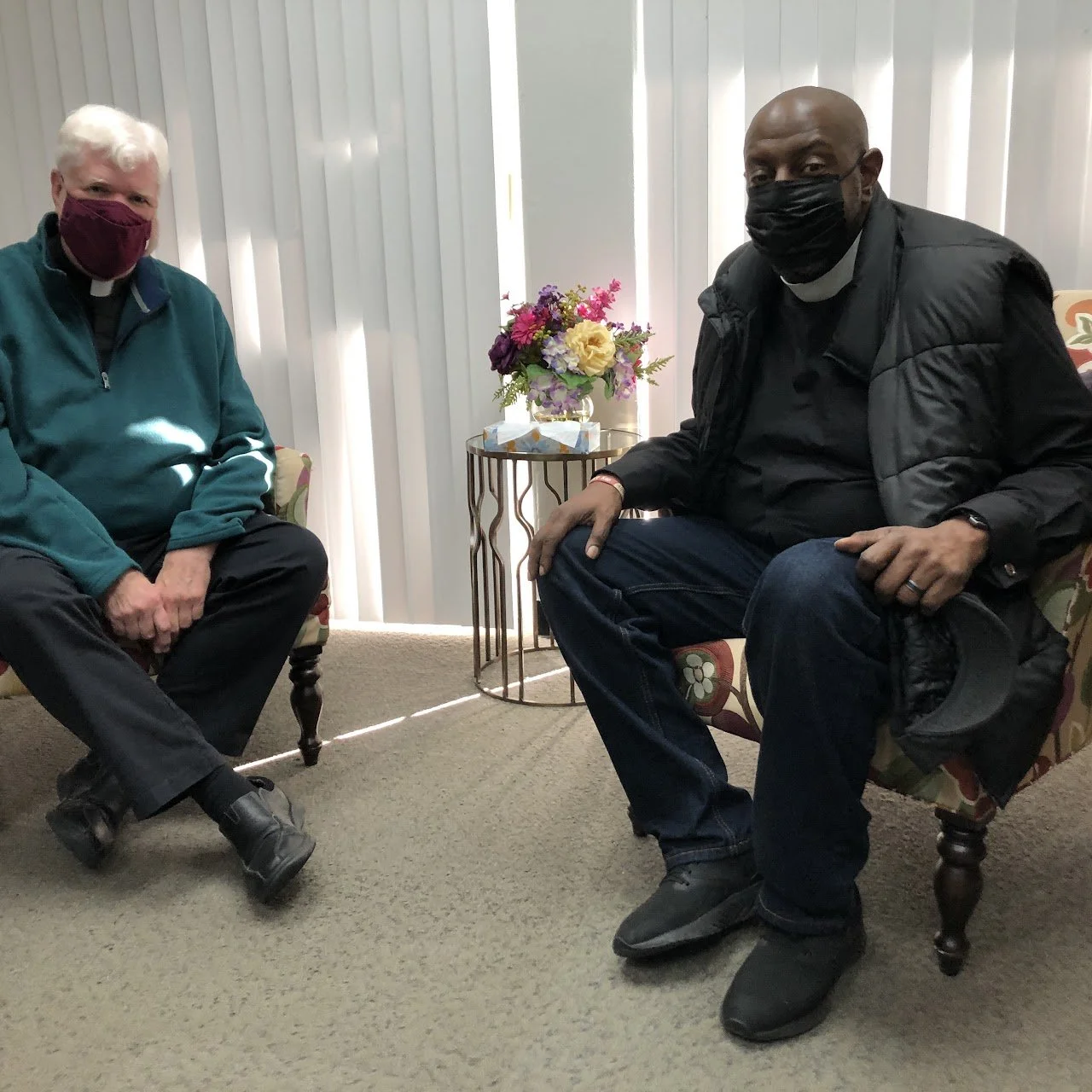 Rev. Lyle Beckman and Rev. Johnny confer about Night Ministry history