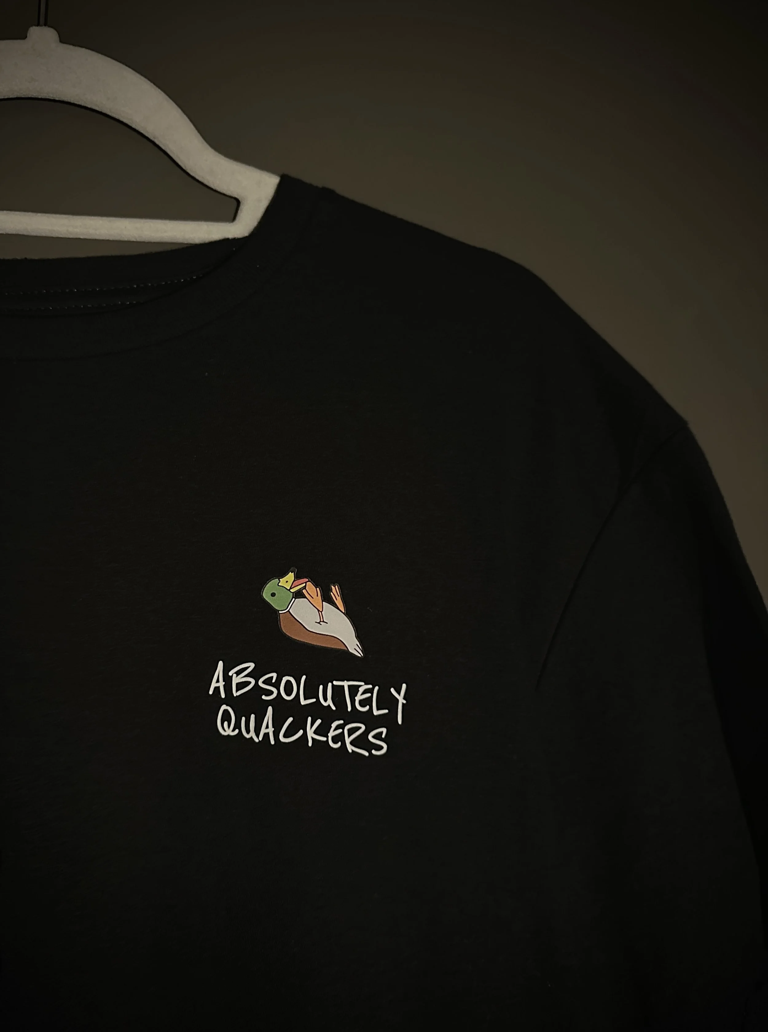 Black T-shirt with a duck and the text 'Absolutely Quackers'