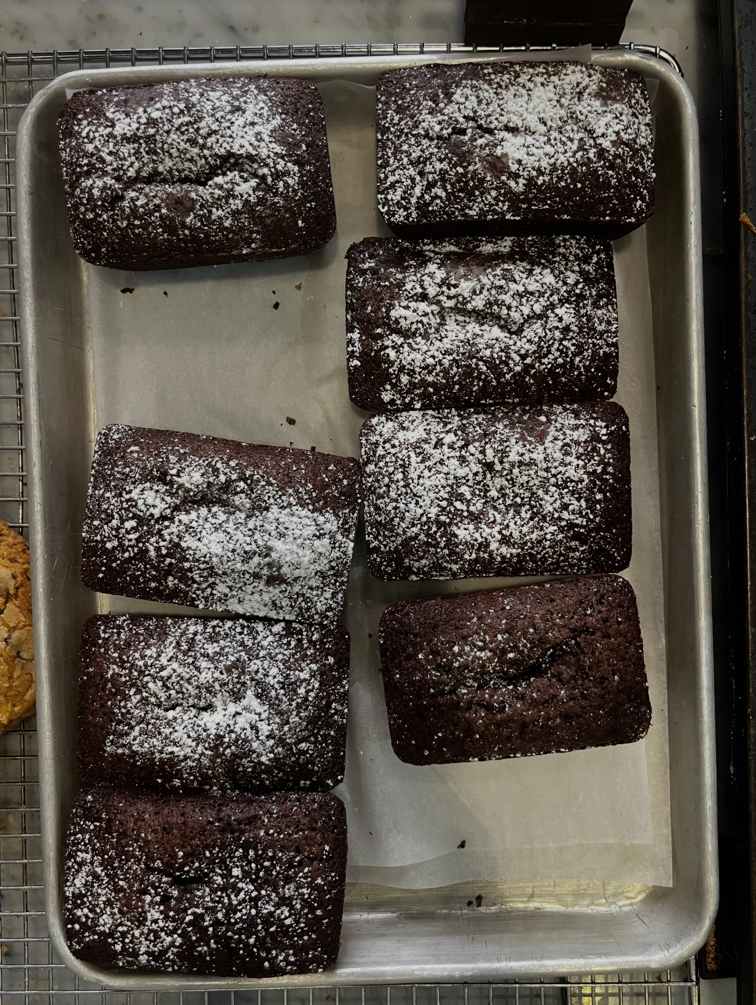 Introducing our LAVA LOAF. It's a chocolate loaf shaped cake/ brownie thing that's goopy in the middle and sturdy on the the outside. We're trying to do like an artisanal  take on the ubiquitous lava cakes that you know from all those big chains that