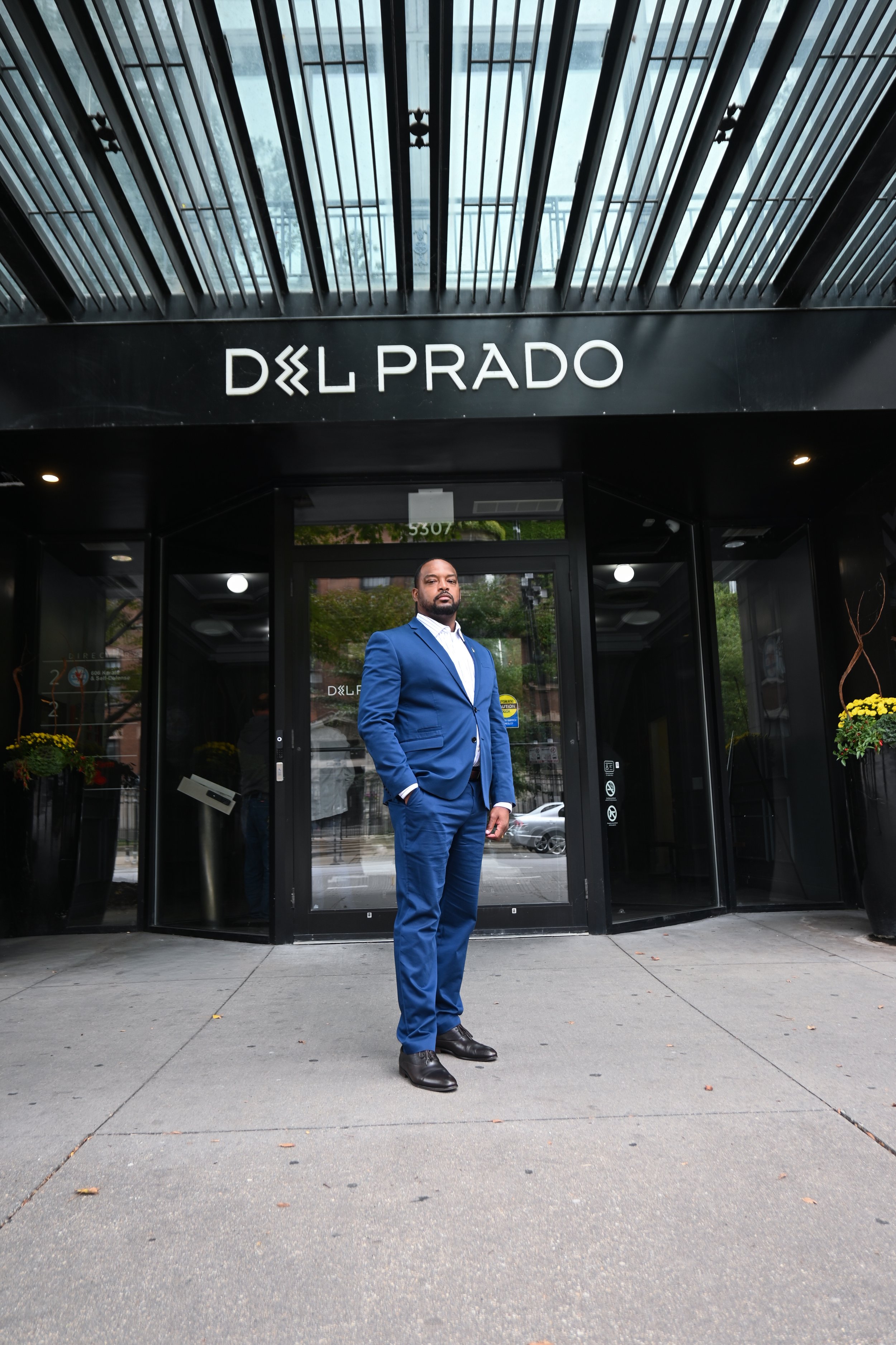 NWM Hyde Park's Rasheed Ward Standing in Front of Del Prado Building.