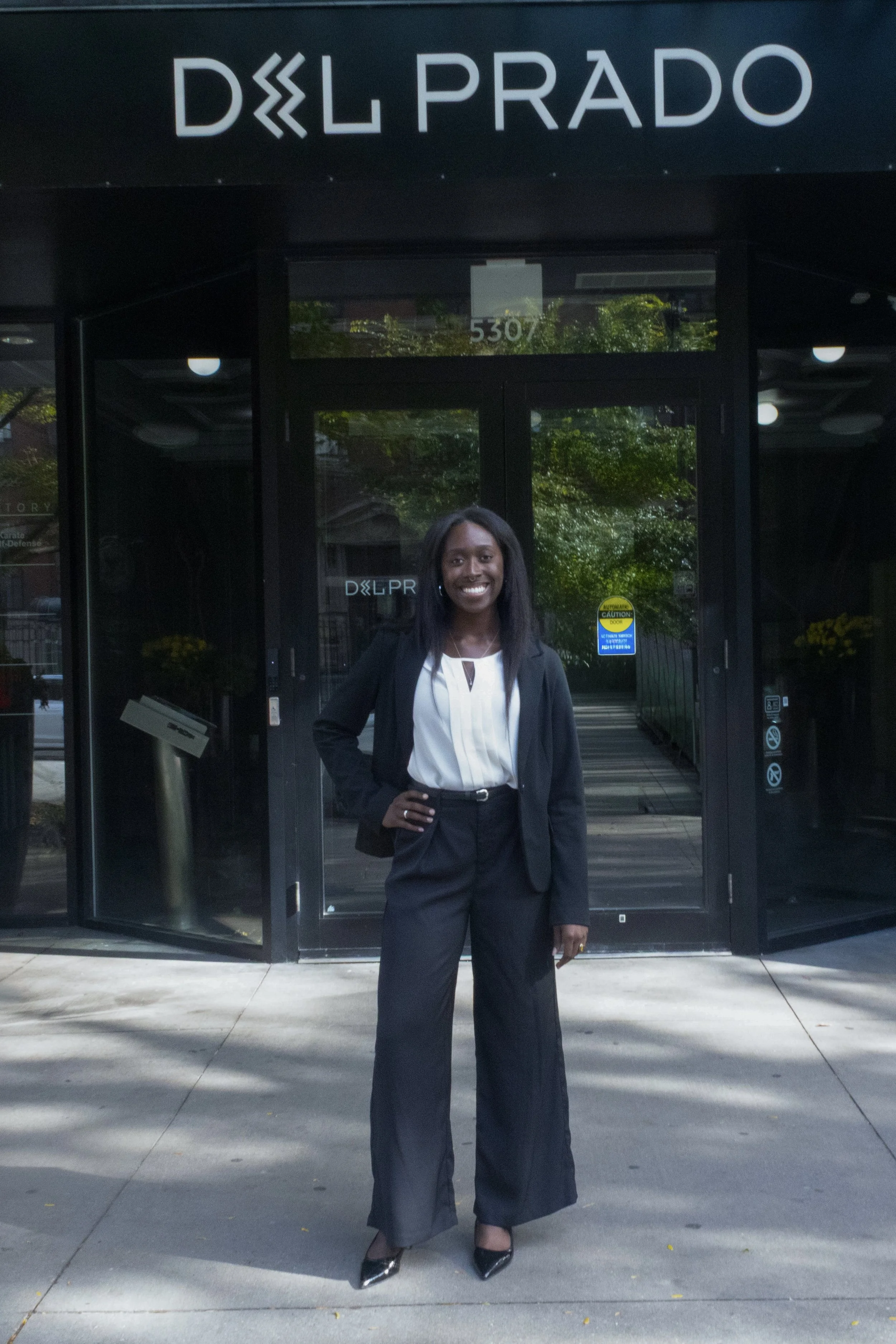 NWM Hyde Park's Kearia Williams Standing in Front of Del Prado Building.