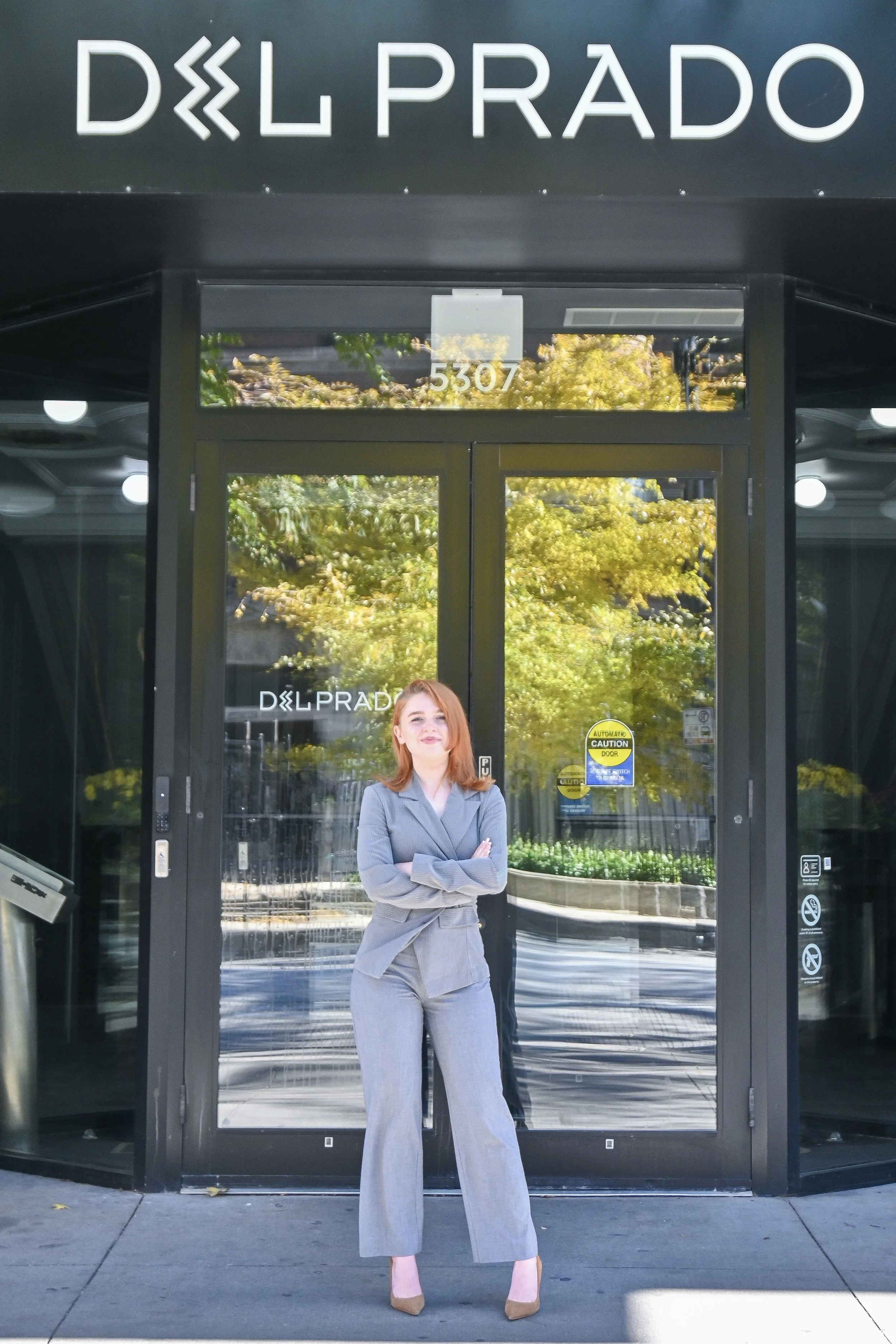 NWM Hyde Park's Sophia Scherwenka Standing in Front of Del Prado Building.