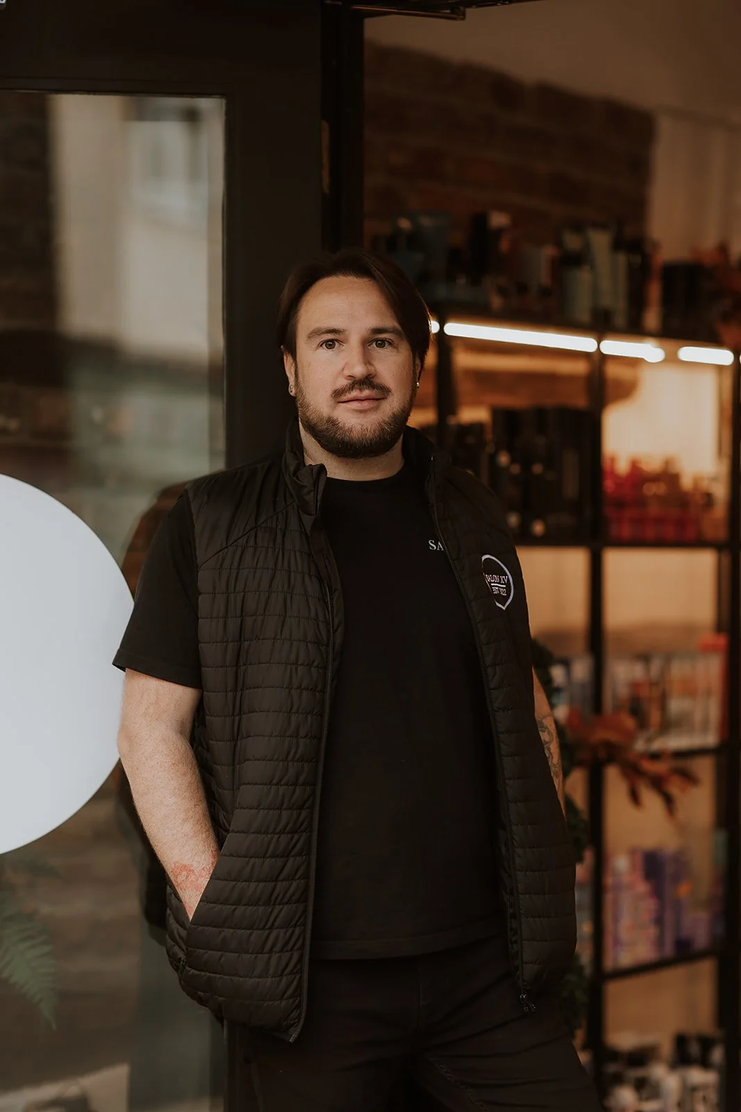 Martyn Lewis-Evans standing outside Salon XV in Oswestry