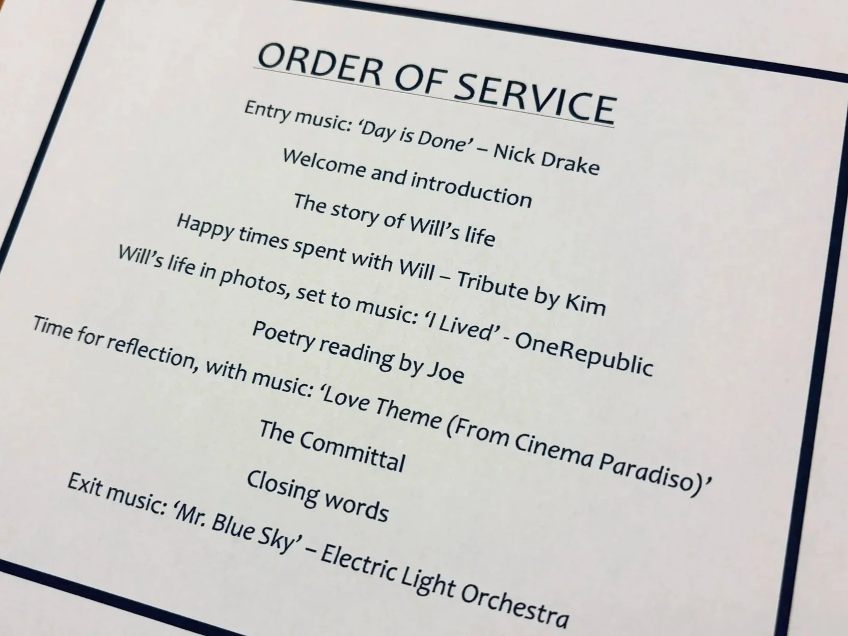 A paper with text showing the order of service for a funeral