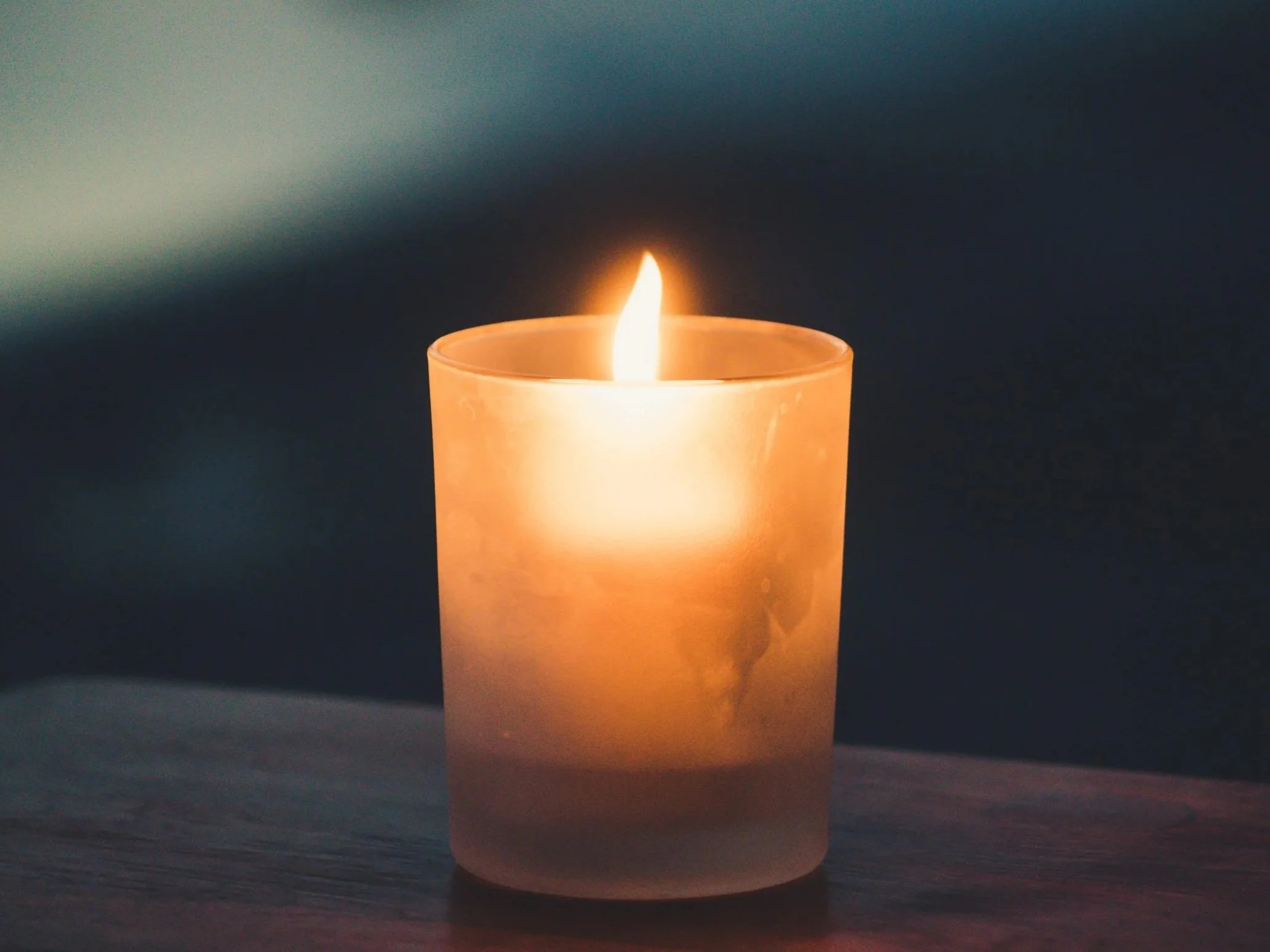 A candle on a table