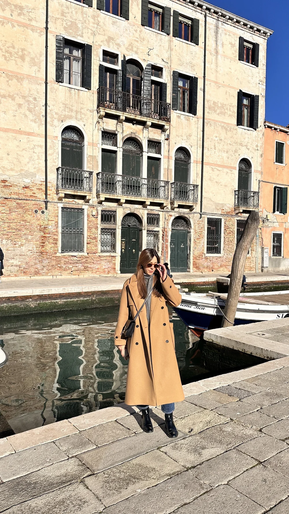 wander-senses-dorsodouro-neighborhood-woman-in-winter-coat.JPEG