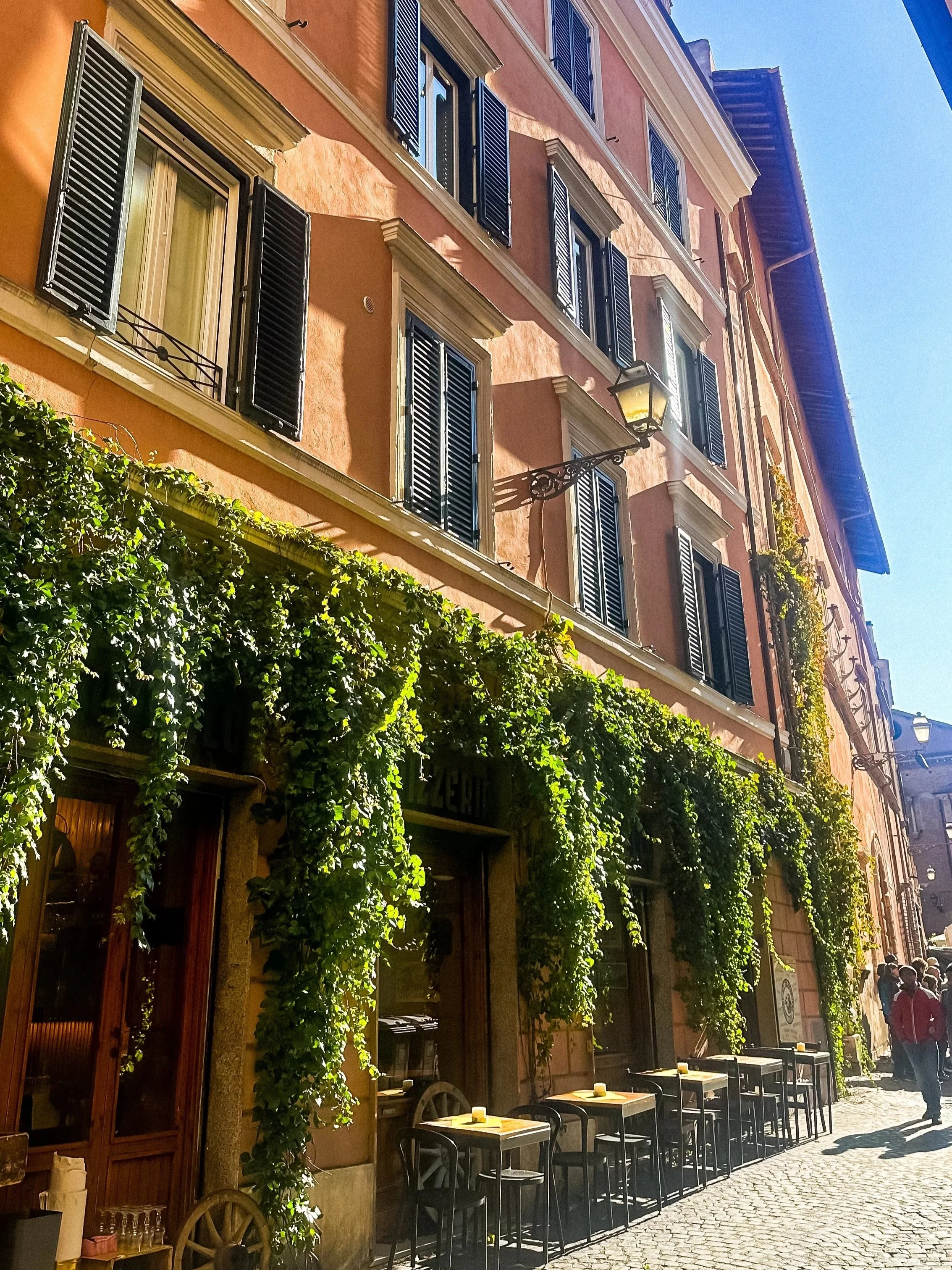 wander-senses-rome-travel-guide-trastevere-colorful-buildings.jpg