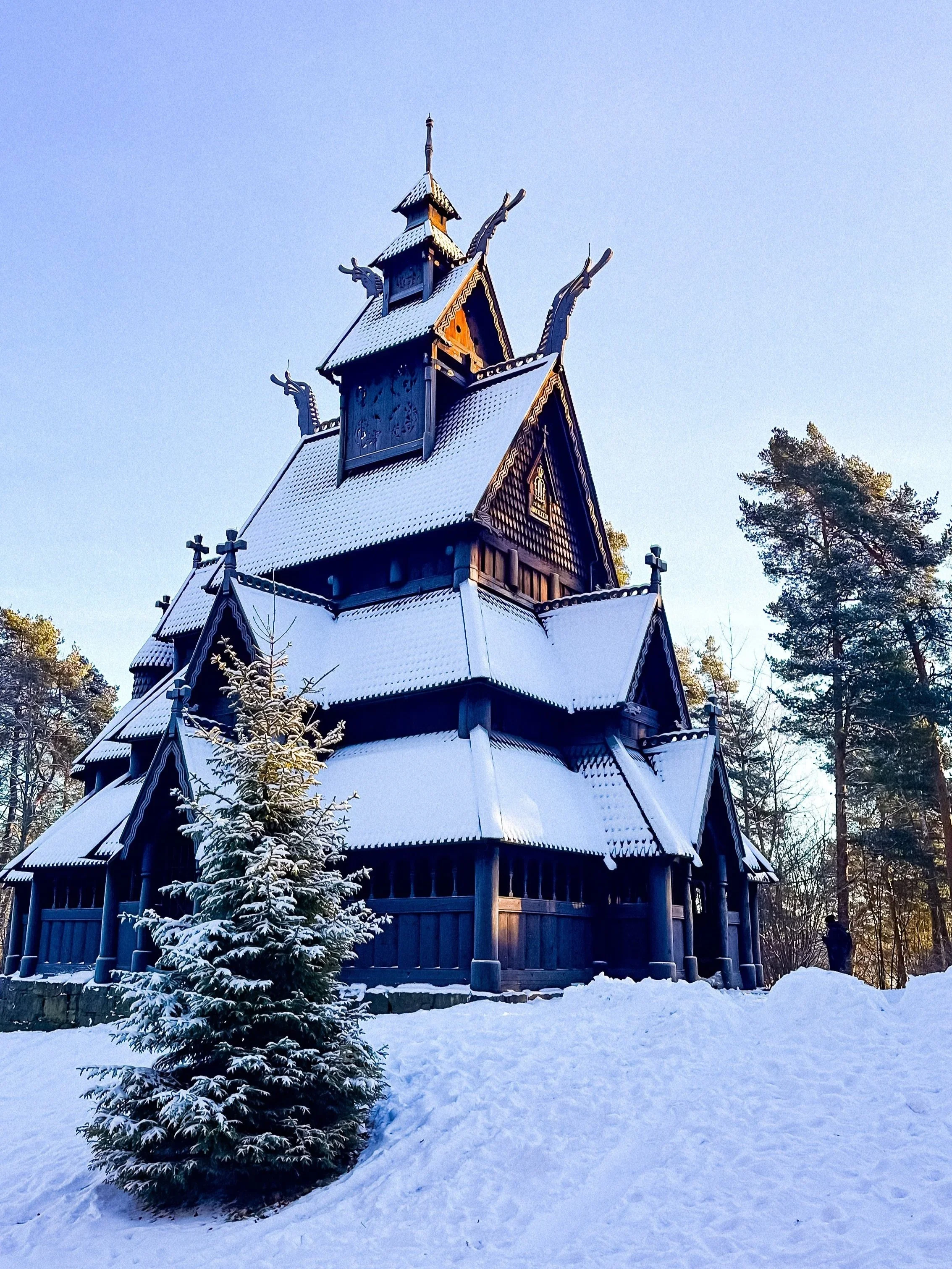 wander-senses-norway-oslo-guide-folk-museum-pink-wooden-church-covered-with-snow.jpg