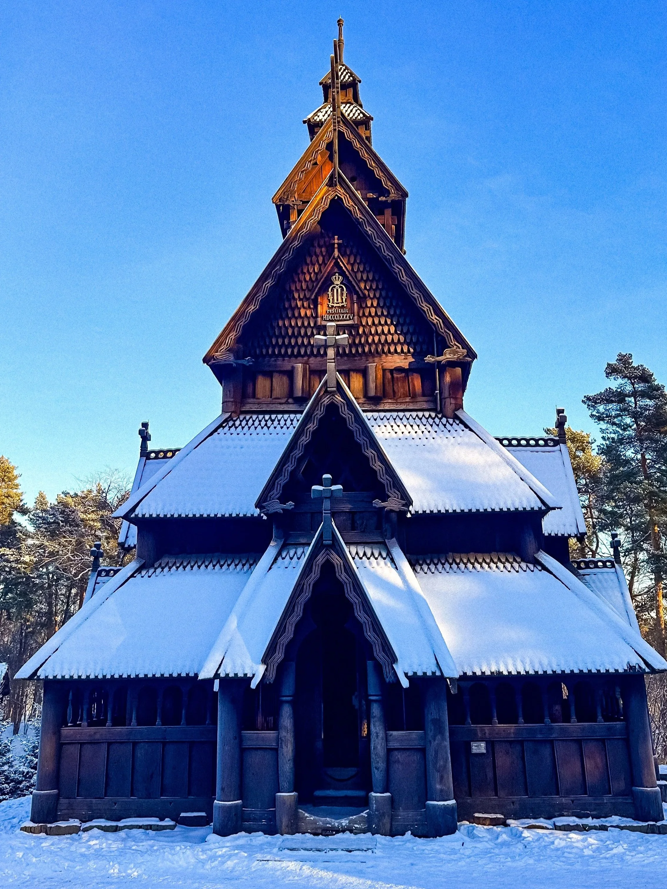 wander-senses-norway-oslo-guide-folk-museum-pink-wooden-church-covered-with-snow.jpg