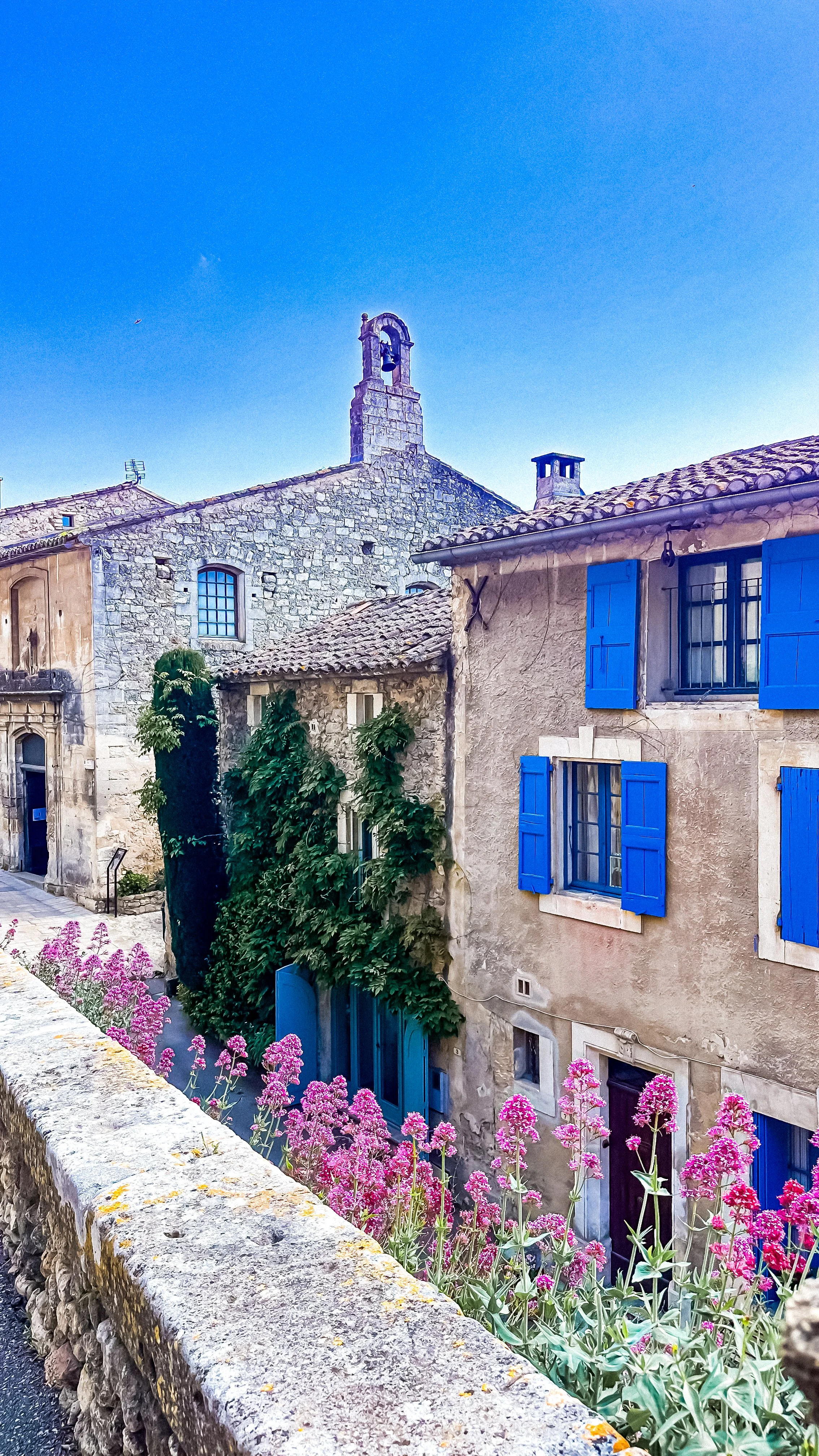 provencal stone houses with blue windows in Menerbes south of France