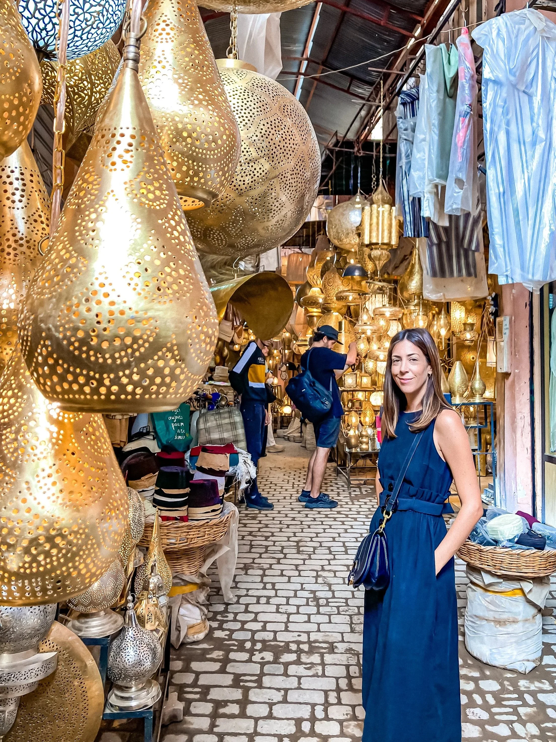 wander-senses-marrakech-souk-stores-lamps-woman-looking.jpg