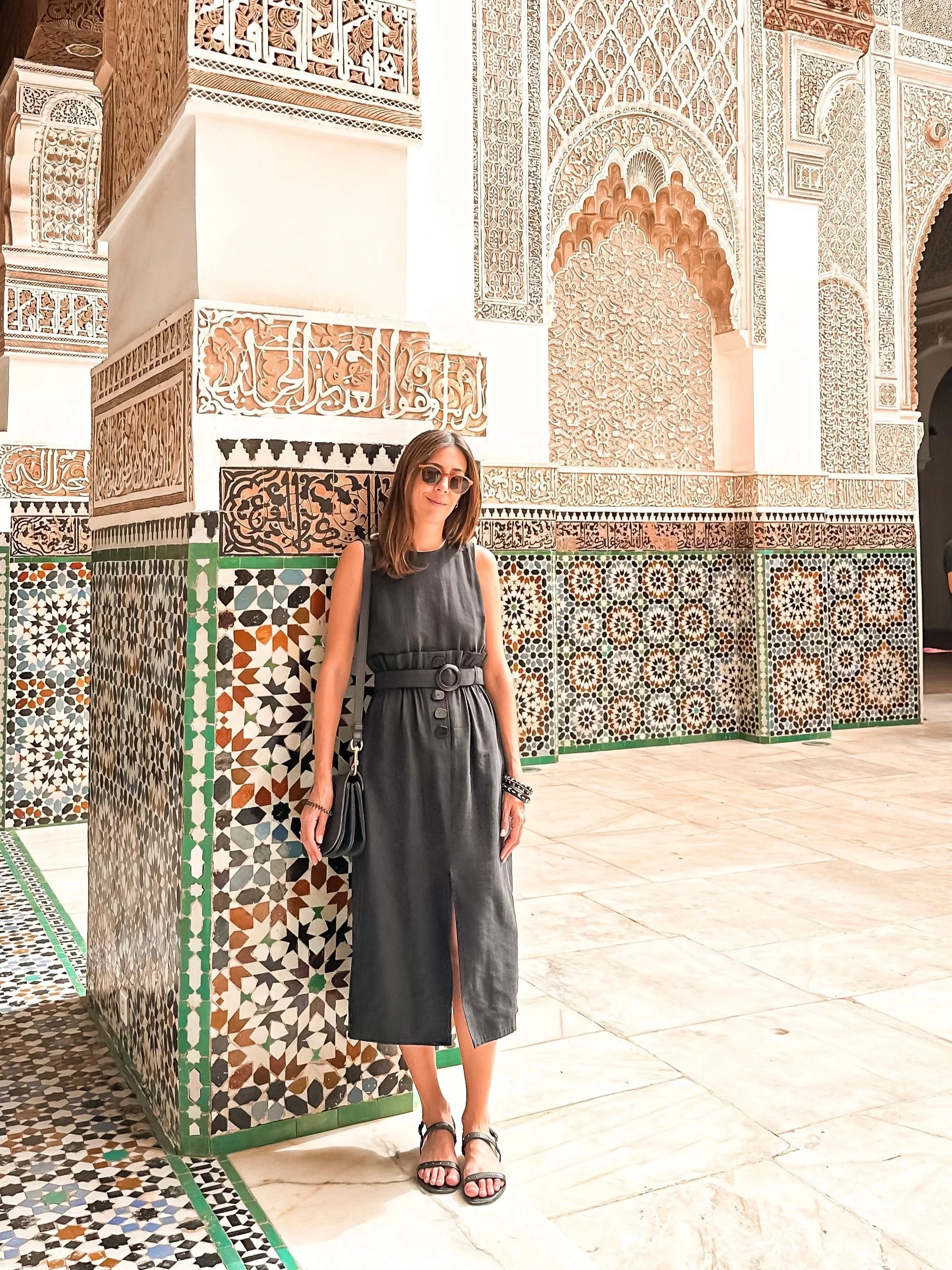 wander-senses-marrakech-ben-youssef-medersa-woman-with-a-black-dress-looking.jpg