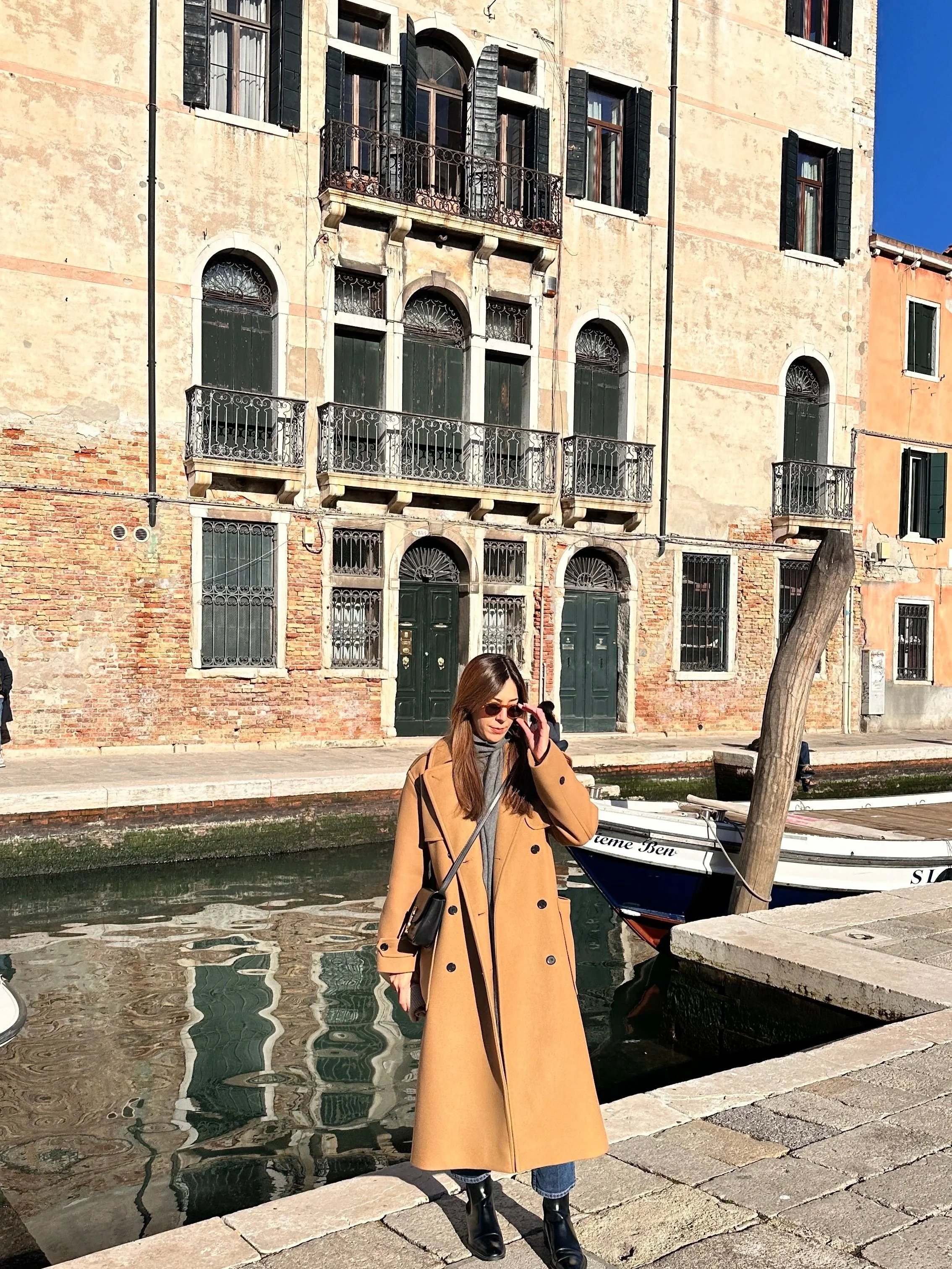 wander-senses-dorsodouro-neighborhood-woman-in-winter-coat.jpg