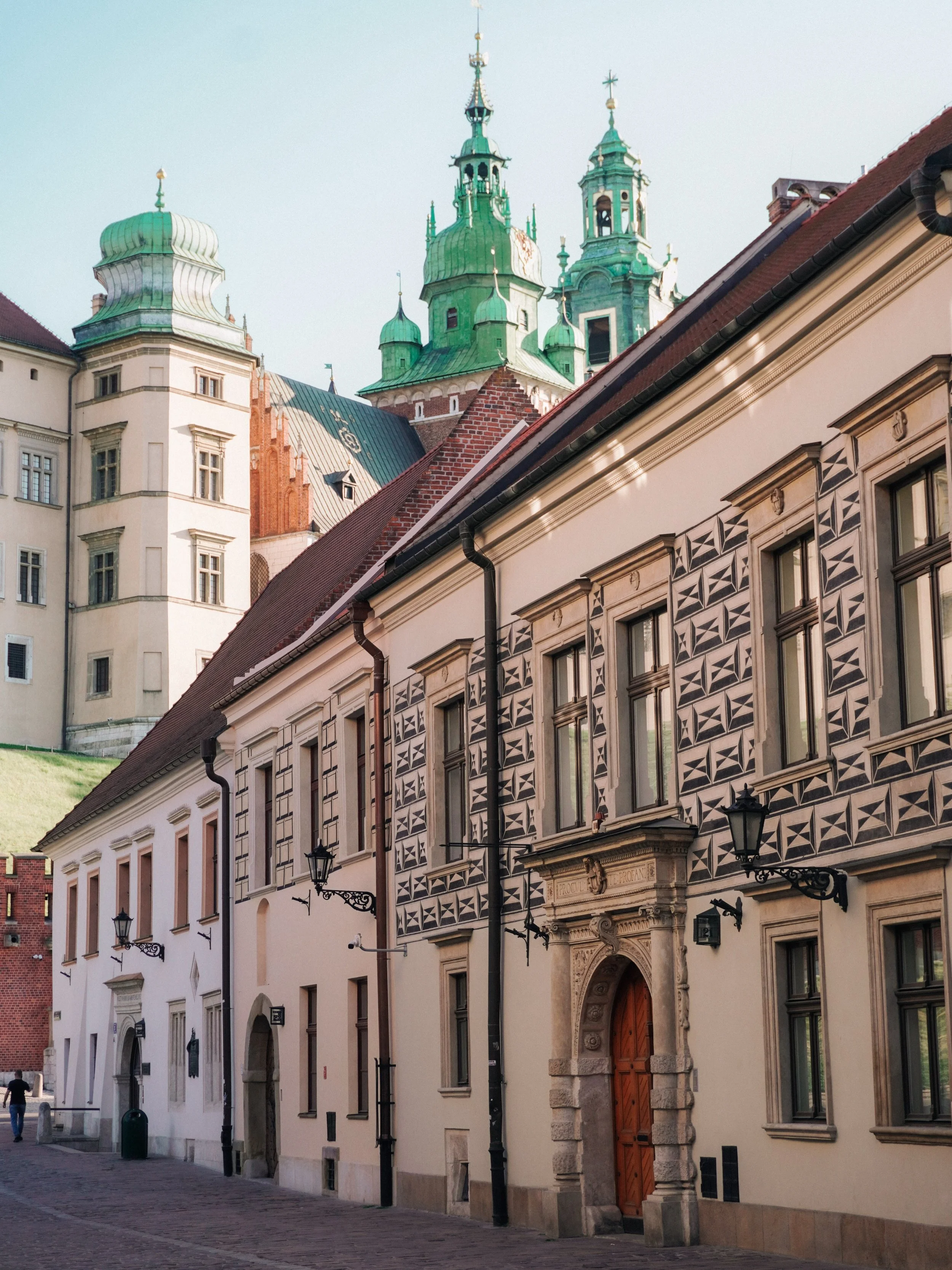 The best thing to do in Krak&oacute;w? Walk without looking at your phone.

By the end of the day, the light catches every fa&ccedil;ade, every carved doorway, every church tower. The Old Town is so beautifully preserved that the more you look up, th