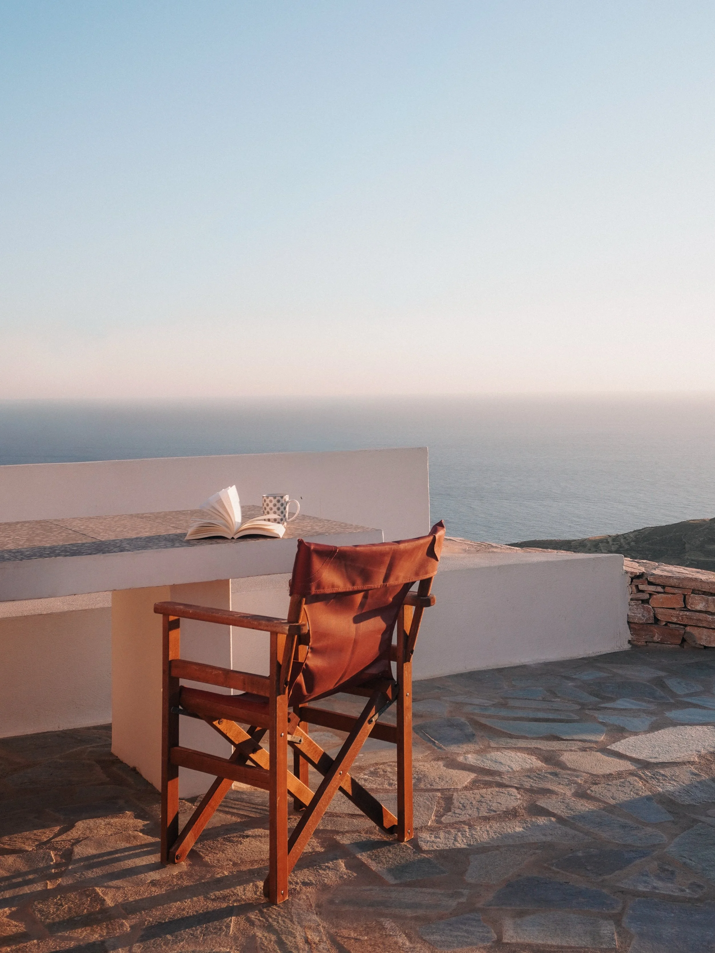 One of my favourite moments in the Cyclades always comes at the end of the day.

After hours spent by the sea, there&rsquo;s nowhere else I&rsquo;d rather be than sitting somewhere quiet with a book, watching the sun slowly disappear into the horizon