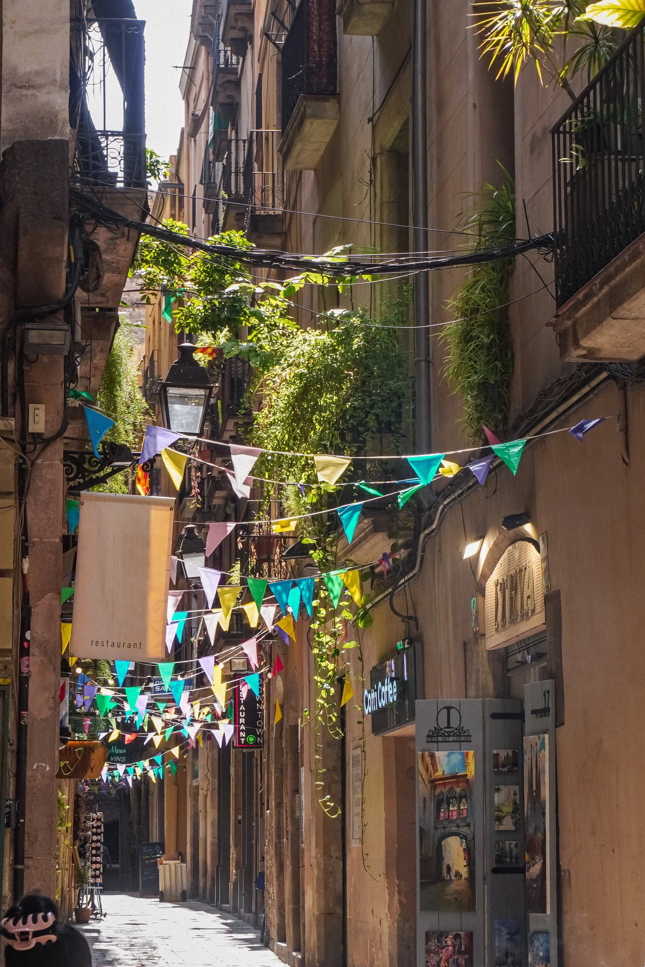 small streets of El Born in Barcelona with sun light
