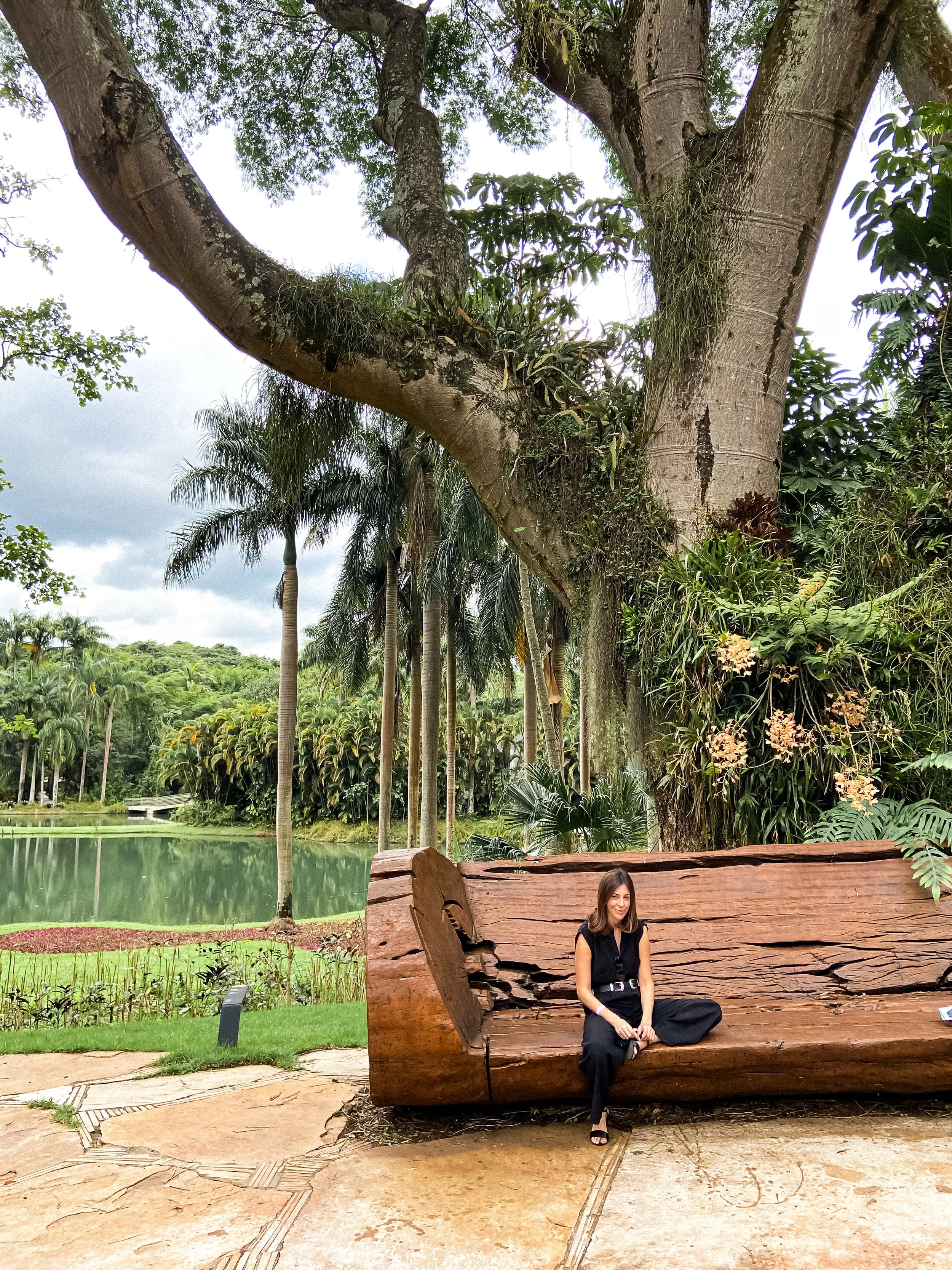 wander-senses-travel-inhotim-brazil-botanical-gardens-with-wooden-bench-and-women-sitting.jpg