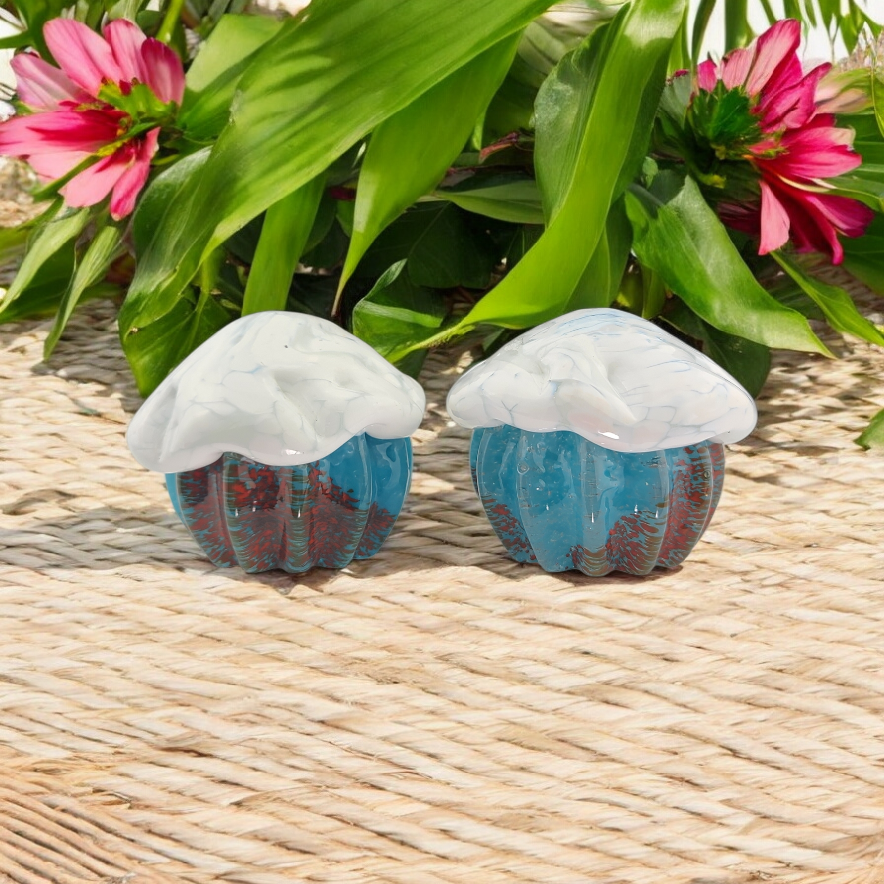 Cupcakes with a White top and Blue with red speckled base