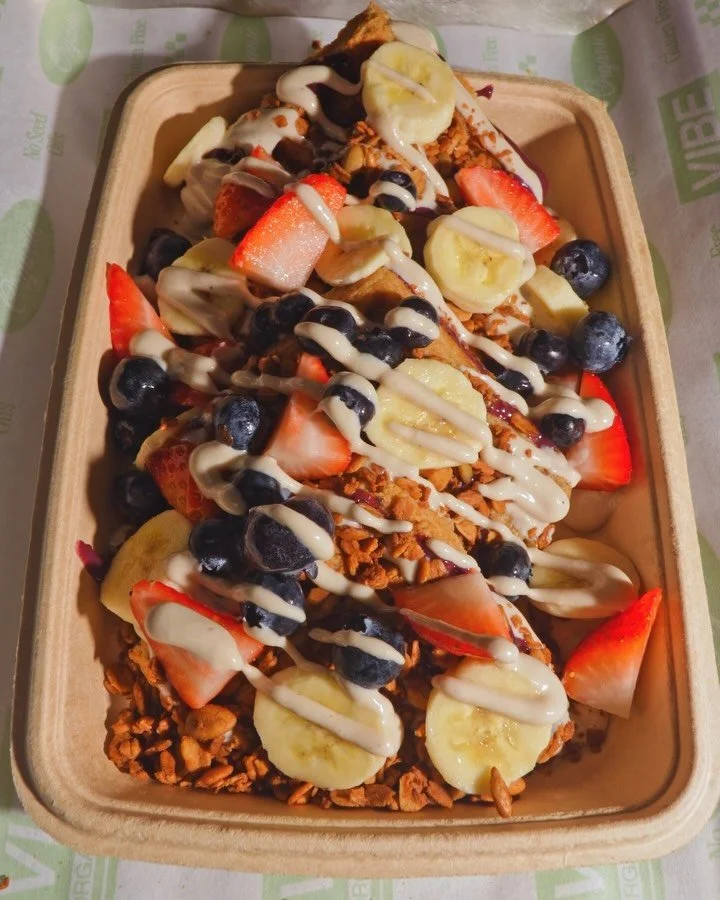 Sweet, satisfying, and packed with protein. 🍓🍌🫐

Gluten-free waffle topped with berries, banana, cashew cream, blueberry-chia jam, granola, and maple syrup.

Your mornings just got better. ✨