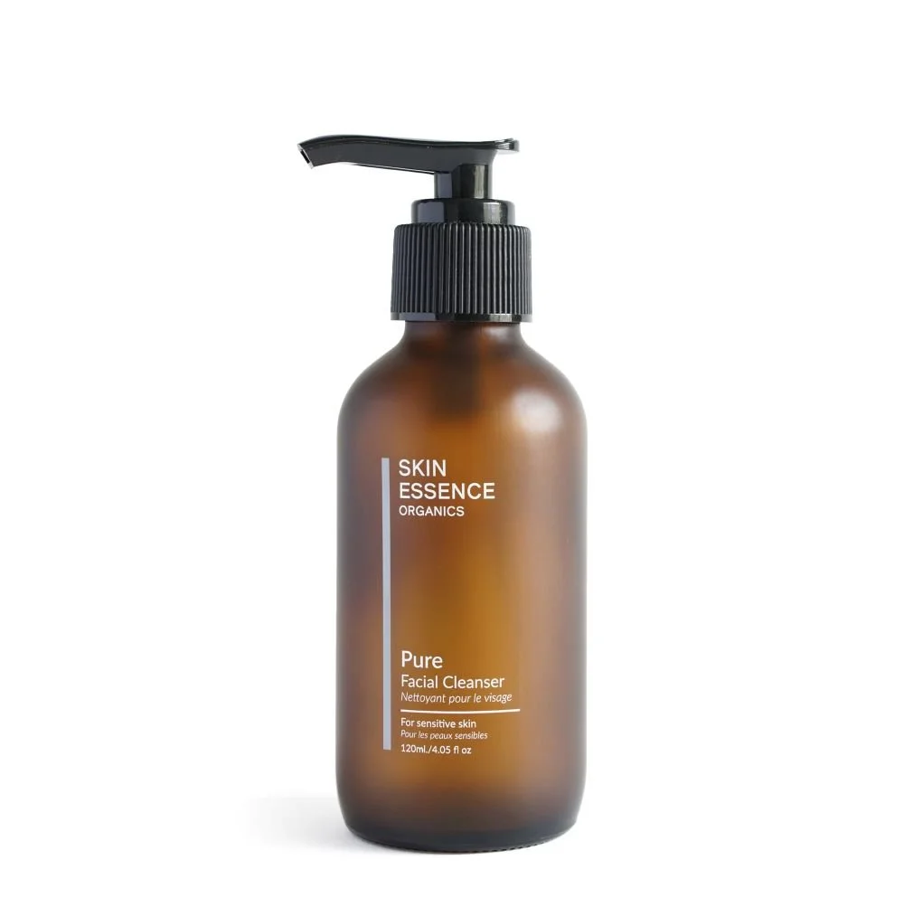 Brown bottle of Skin Essence Organics Pure Facial Cleanser with a black pump dispenser, labeled for sensitive skin, 120ml.