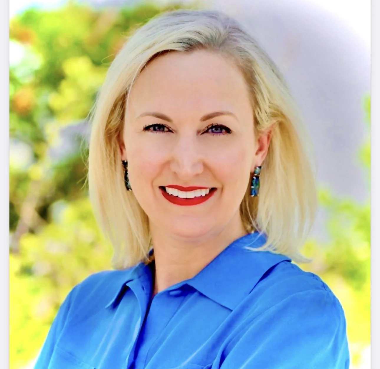 Woman with blonde hair and blue eyes