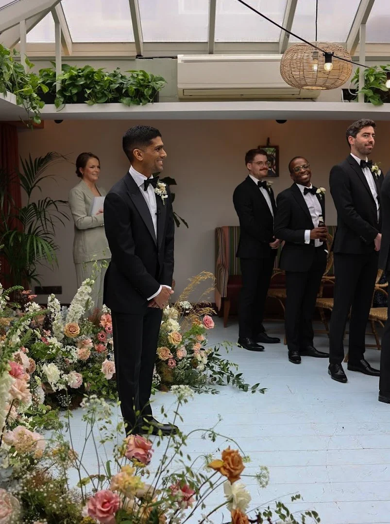 groom waiting for his bride at the alter