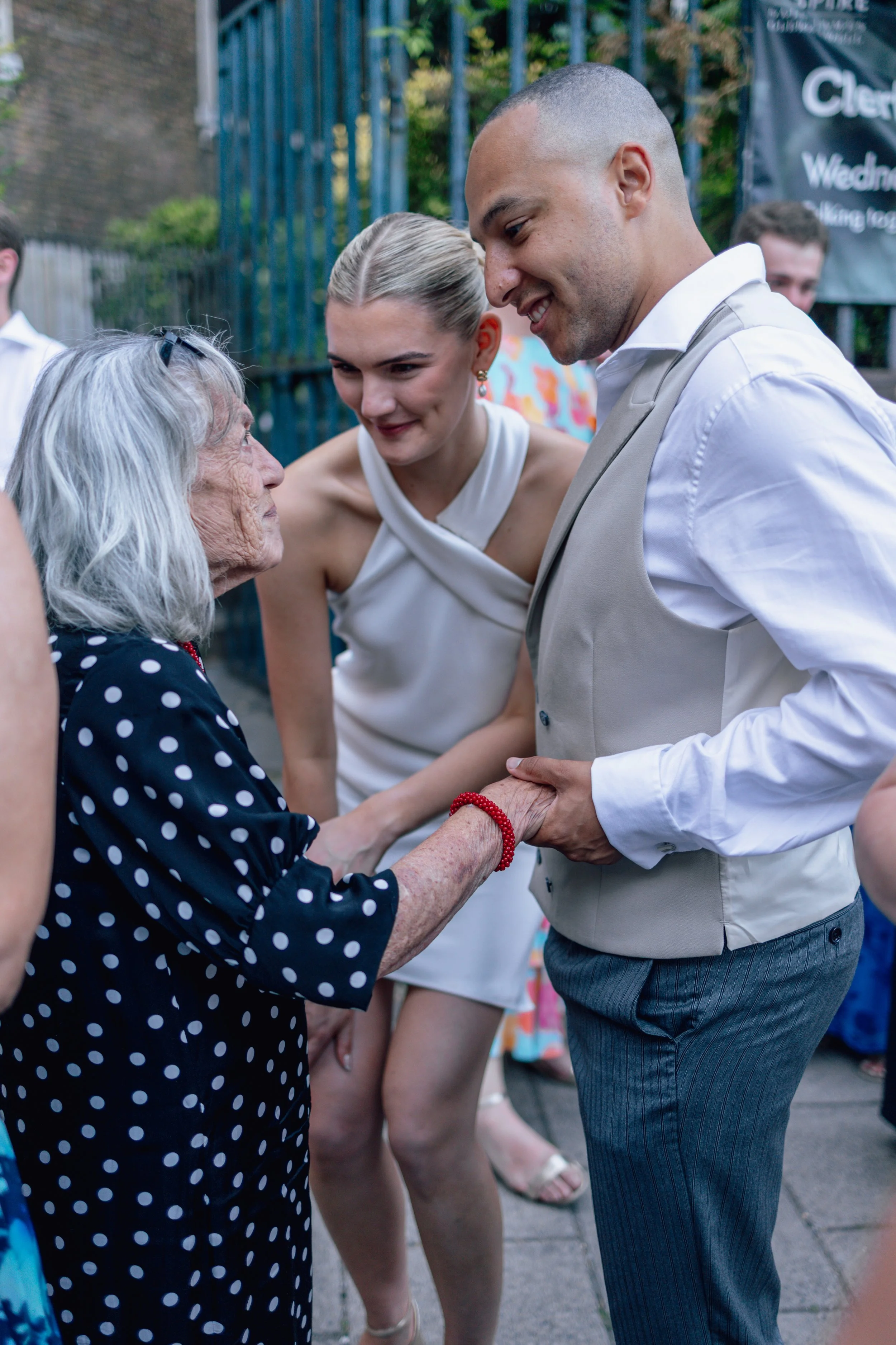 bride and groom with elderly family member