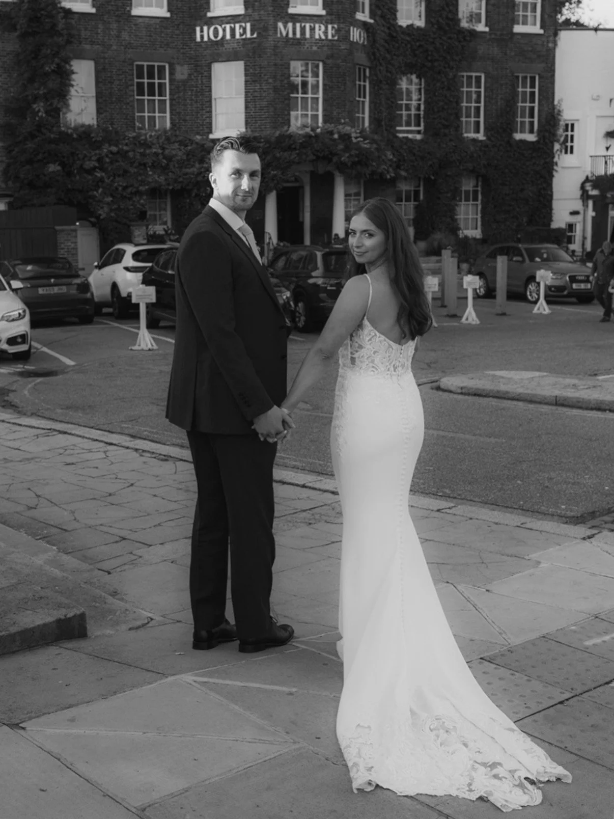 bride and groom outside The Mitre wedding venue