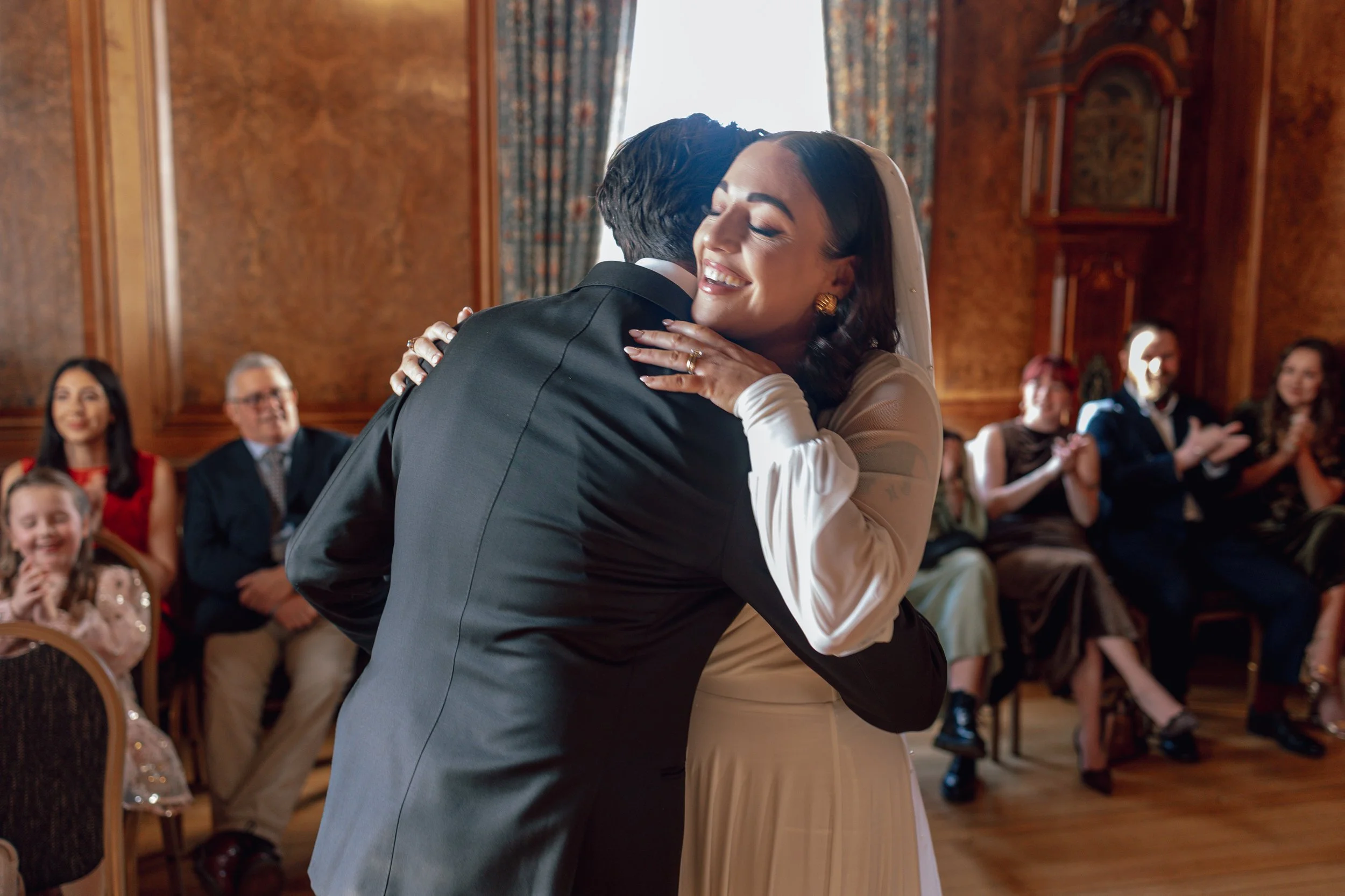 bride smiling and hugging a man