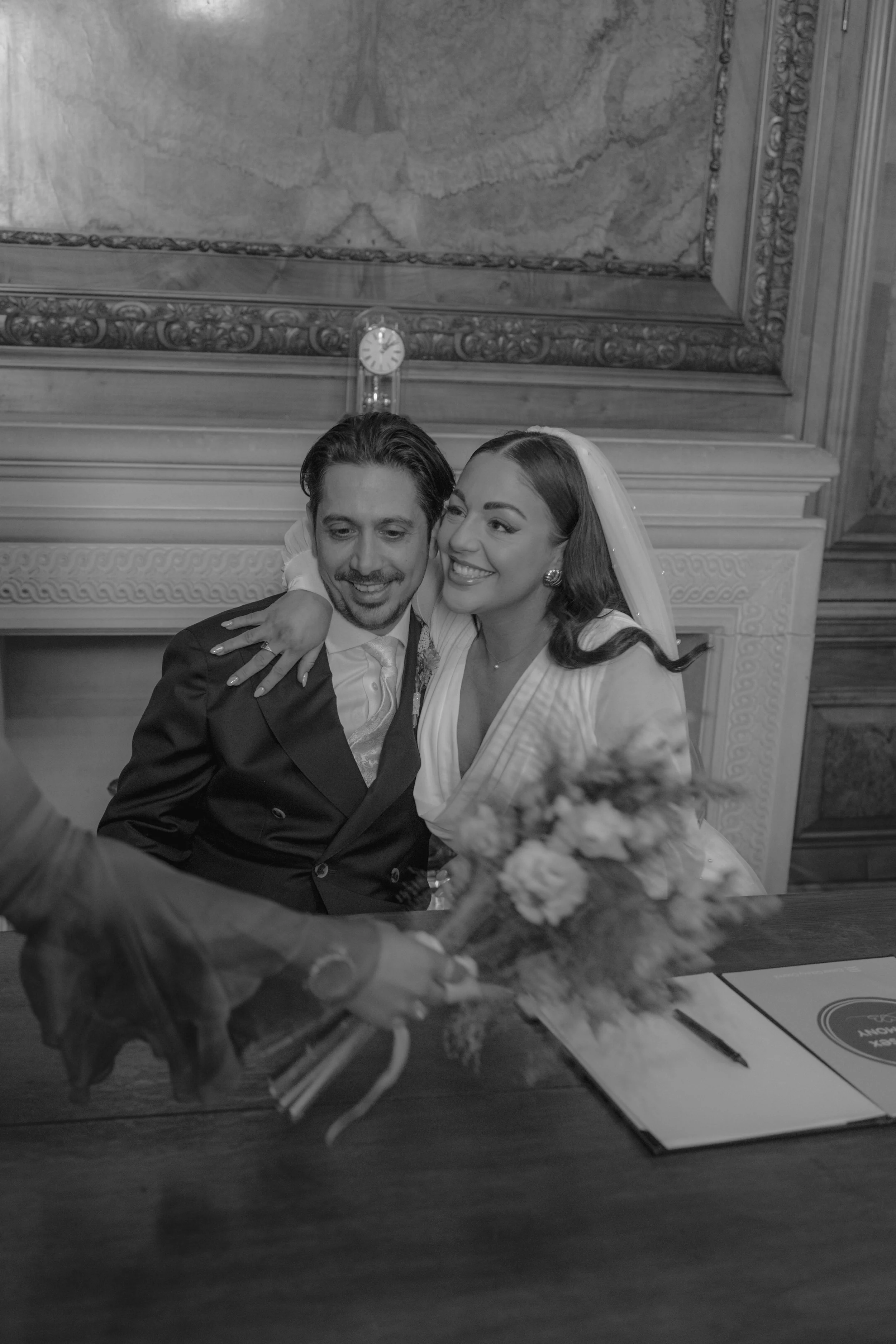 bride and groom signing wedding papers