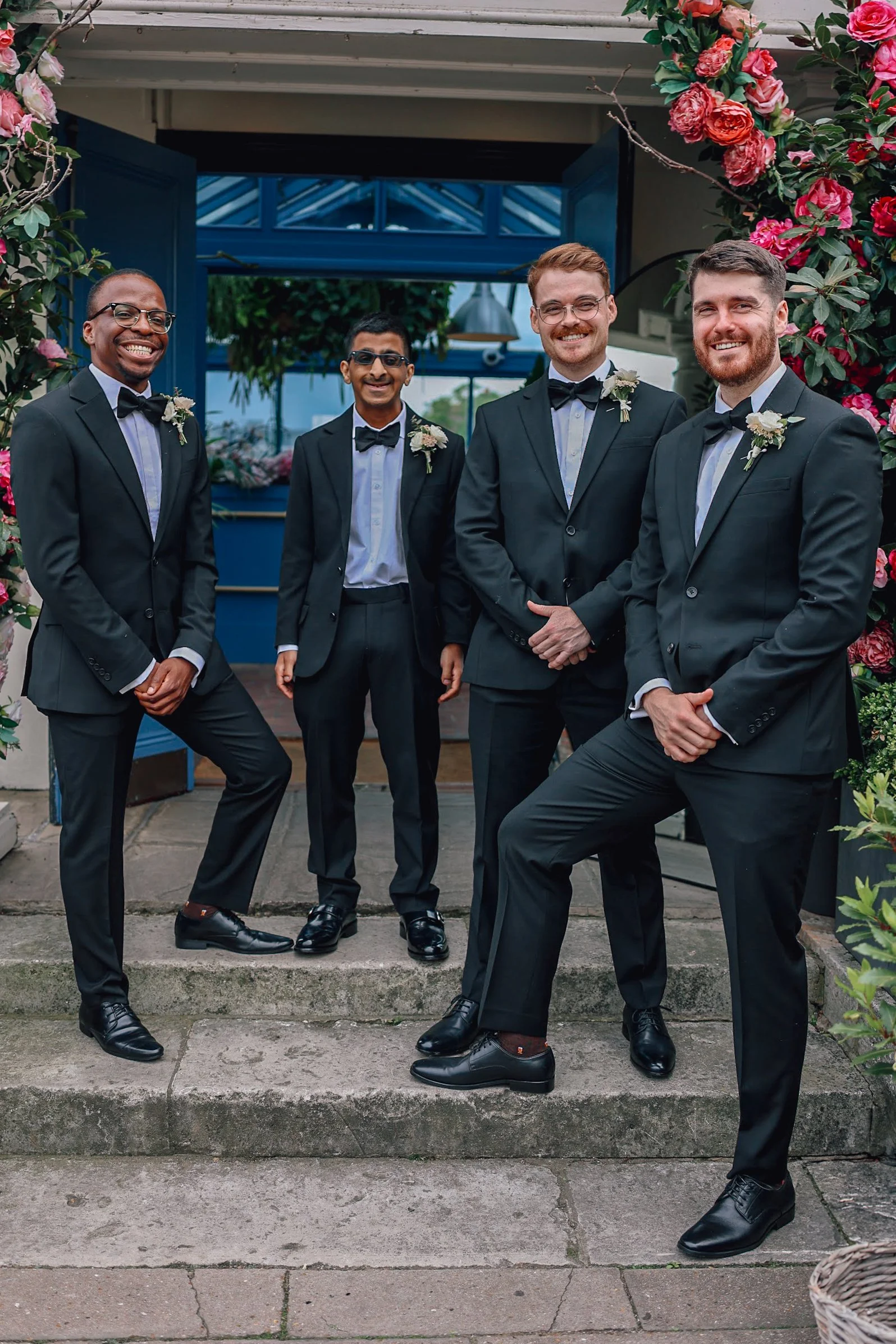 groomsmen on steps at London wedding venue