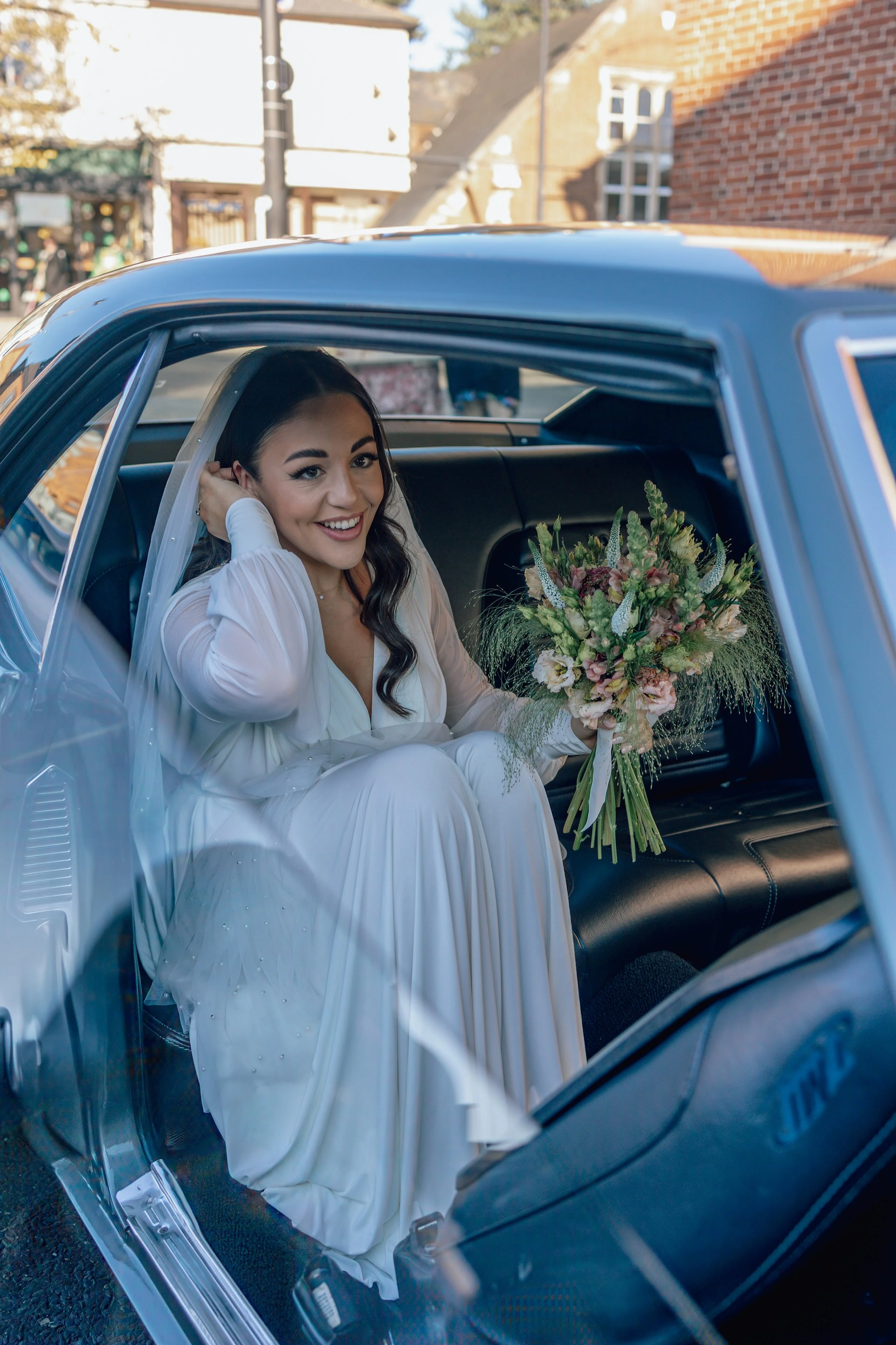 bride arriving in a wedding car