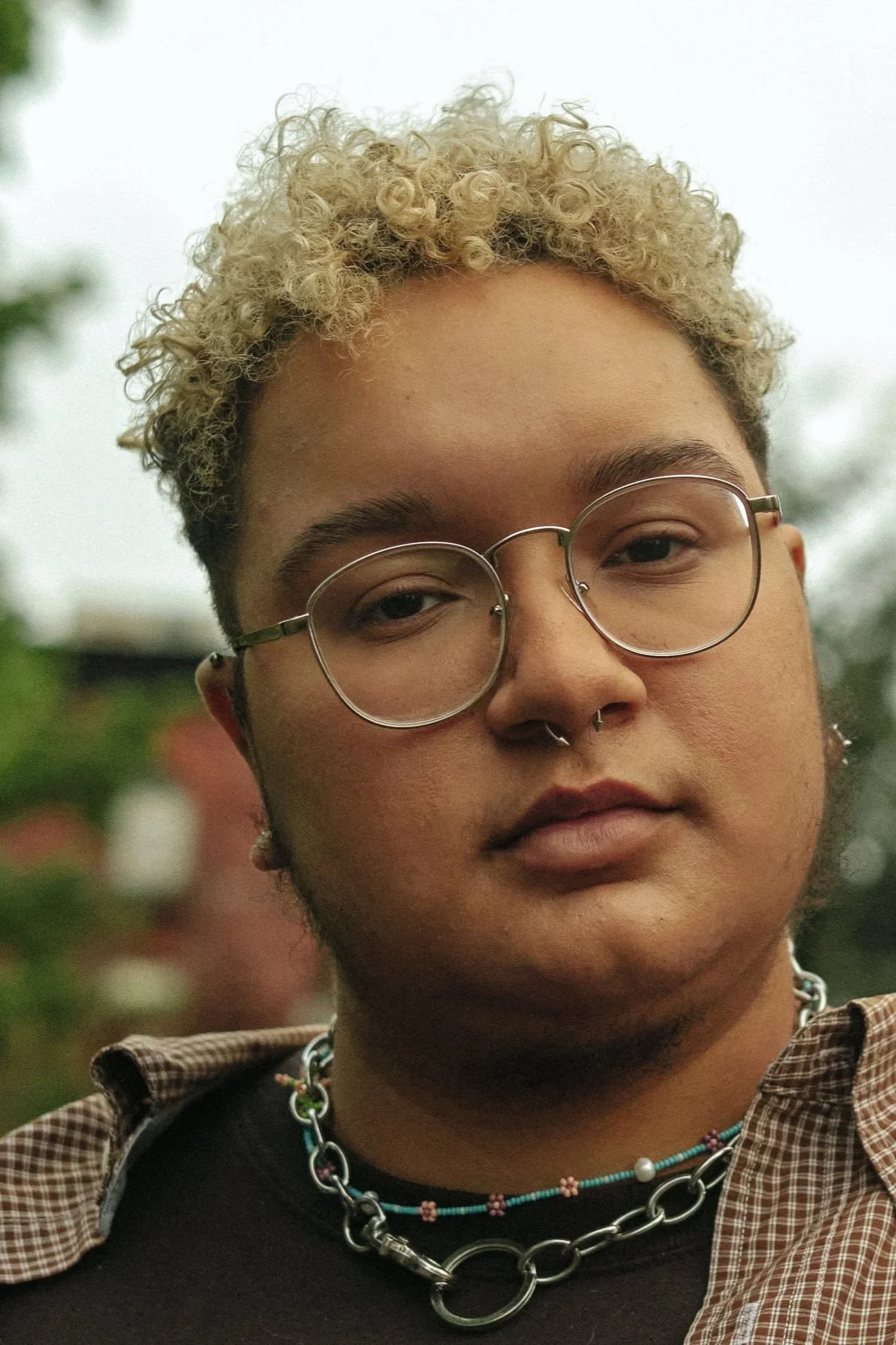 A+transmasculine+non-binary+person+and+non-binary+trans+woman+standing+next+to+each+other+outside.jpg