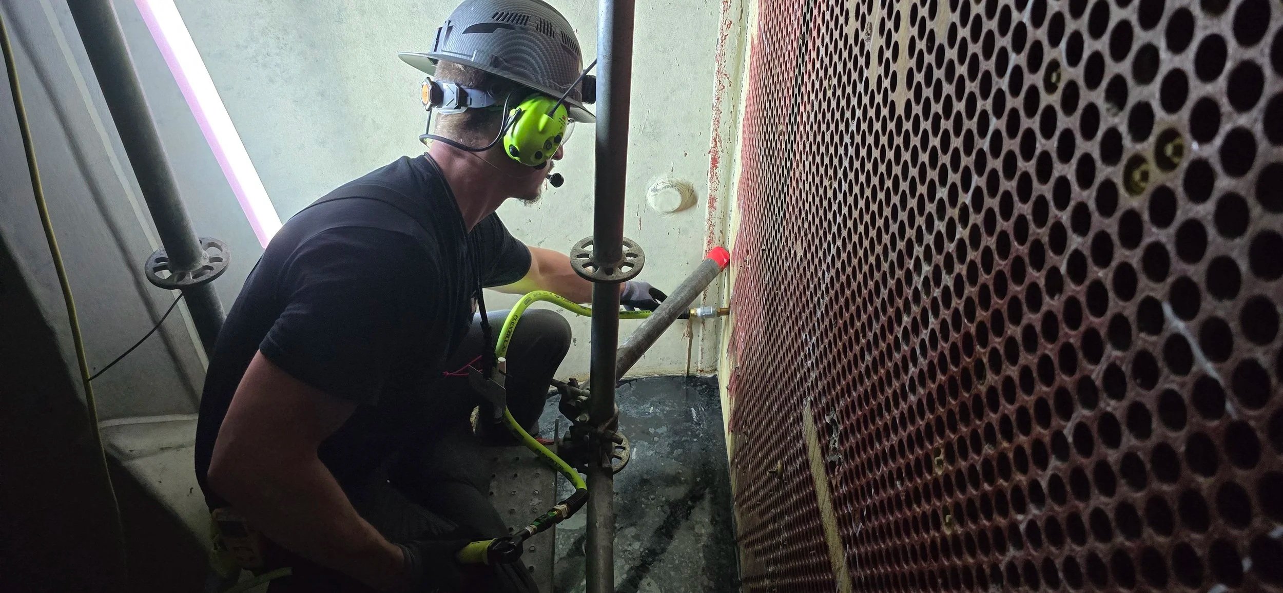 Absolute Maintenance Solutions performing helium leak detection on a condenser tube. There were 17 leaks identified in this waterbox during this evolution at a Nuclear Power Plant