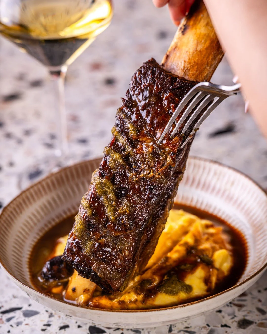 Braised Beef Short Rib, served with rich beef jus, polenta mash and spicy mojo sauce. 

The ultimate winter dish (that tastes even better with a glass of red) 🍷