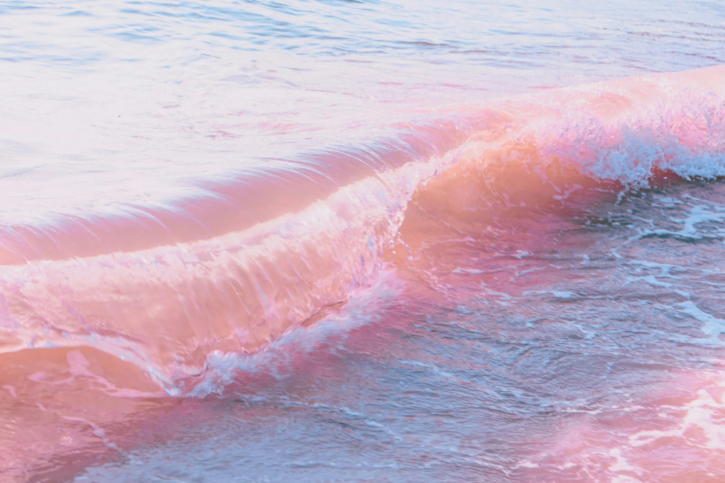 Pink ocean waves along the Oregon Coast, reflecting calm and healing found through body image therapy in Newport, Oregon