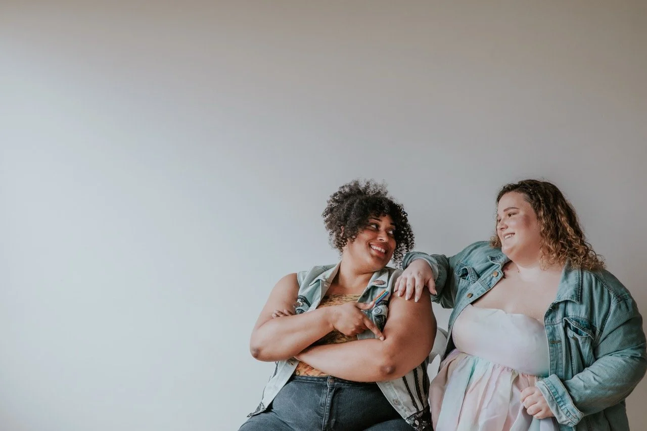 Two women embracing warmly, reflecting the supportive relationships built through therapy in Oregon and Colorado