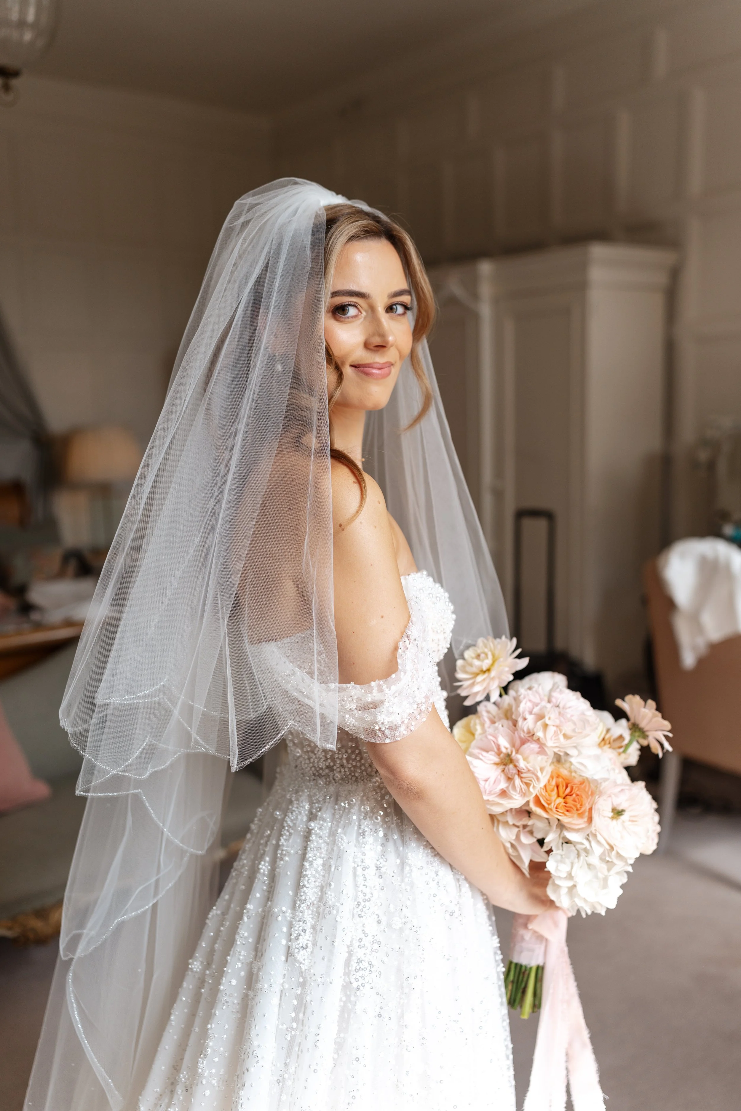 Final look of a bride wearing a cathedral veil ready to walk down the aisle. Hair by Ever by Ellie, Essex.