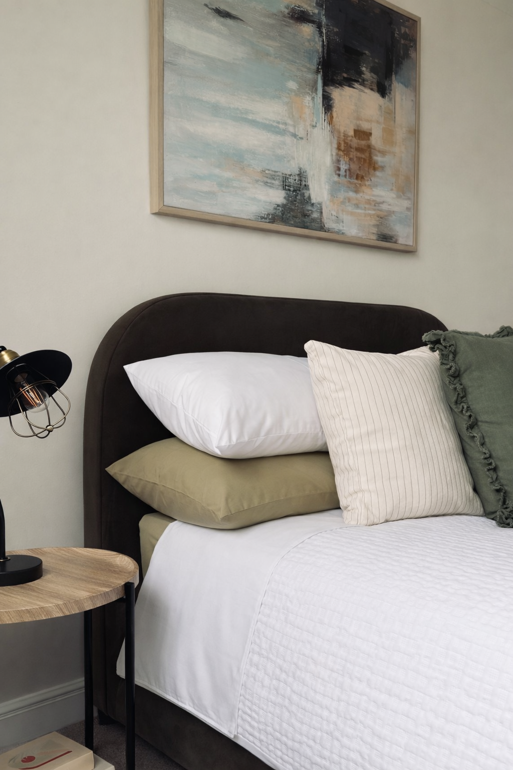 Cosy bedroom with neutral accents.png