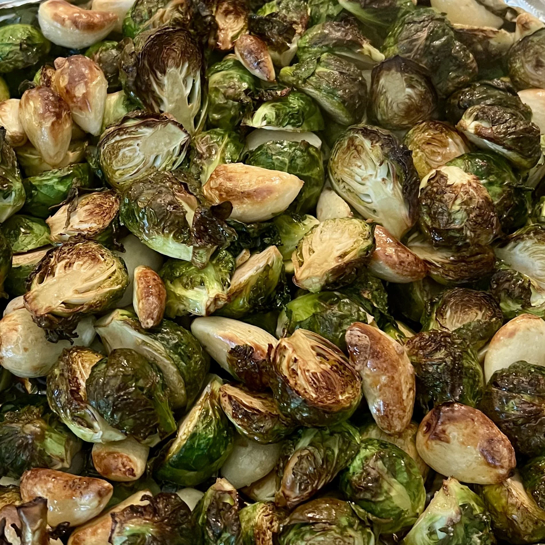 Roasted brussels sprouts with charred and browned edges.